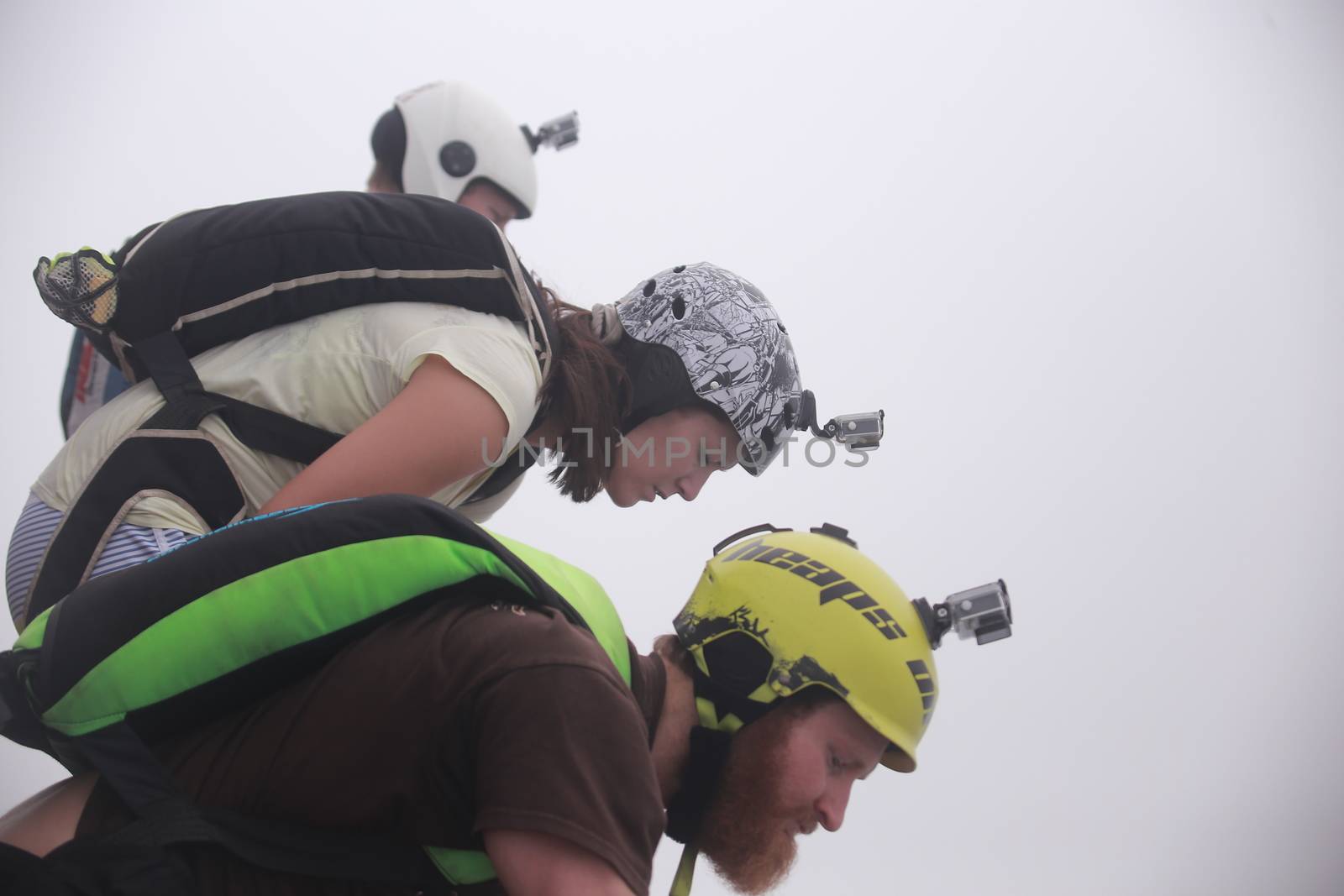 MALAYSIA, Kuala Lumpur: Base jumpers look over edge	Heavy haze didn't deter the 120 thrill-seeking base jumpers as they leapt into the foggy abyss off Kuala Lumpur Tower on October 3, 2015.  	The participants were joining others across the world on the 15th�International Base Jump Day. 