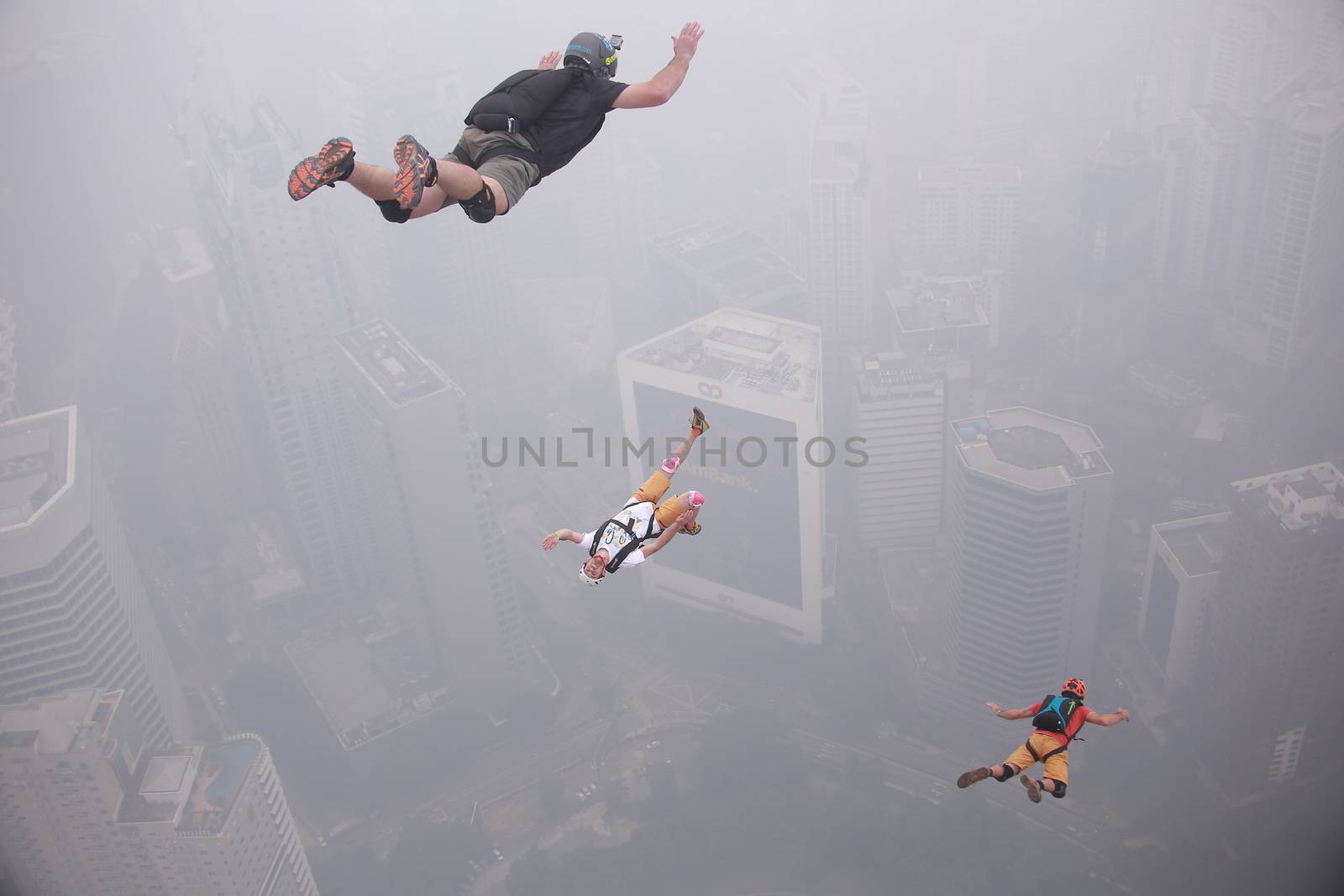 MALAYSIA, Kuala Lumpur: Base jumpers launch into abyss	Heavy haze didn't deter the 120 thrill-seeking base jumpers as they leapt into the foggy abyss off Kuala Lumpur Tower on October 3, 2015.  	The participants were joining others across the world on the 15th�International Base Jump Day. 