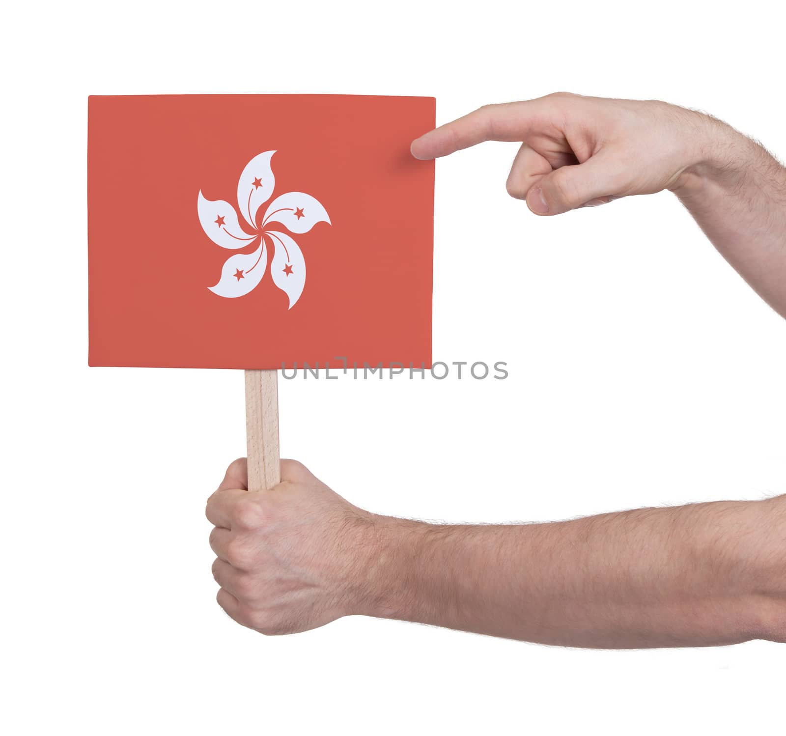 Hand holding small card, isolated on white - Flag of Hong Kong