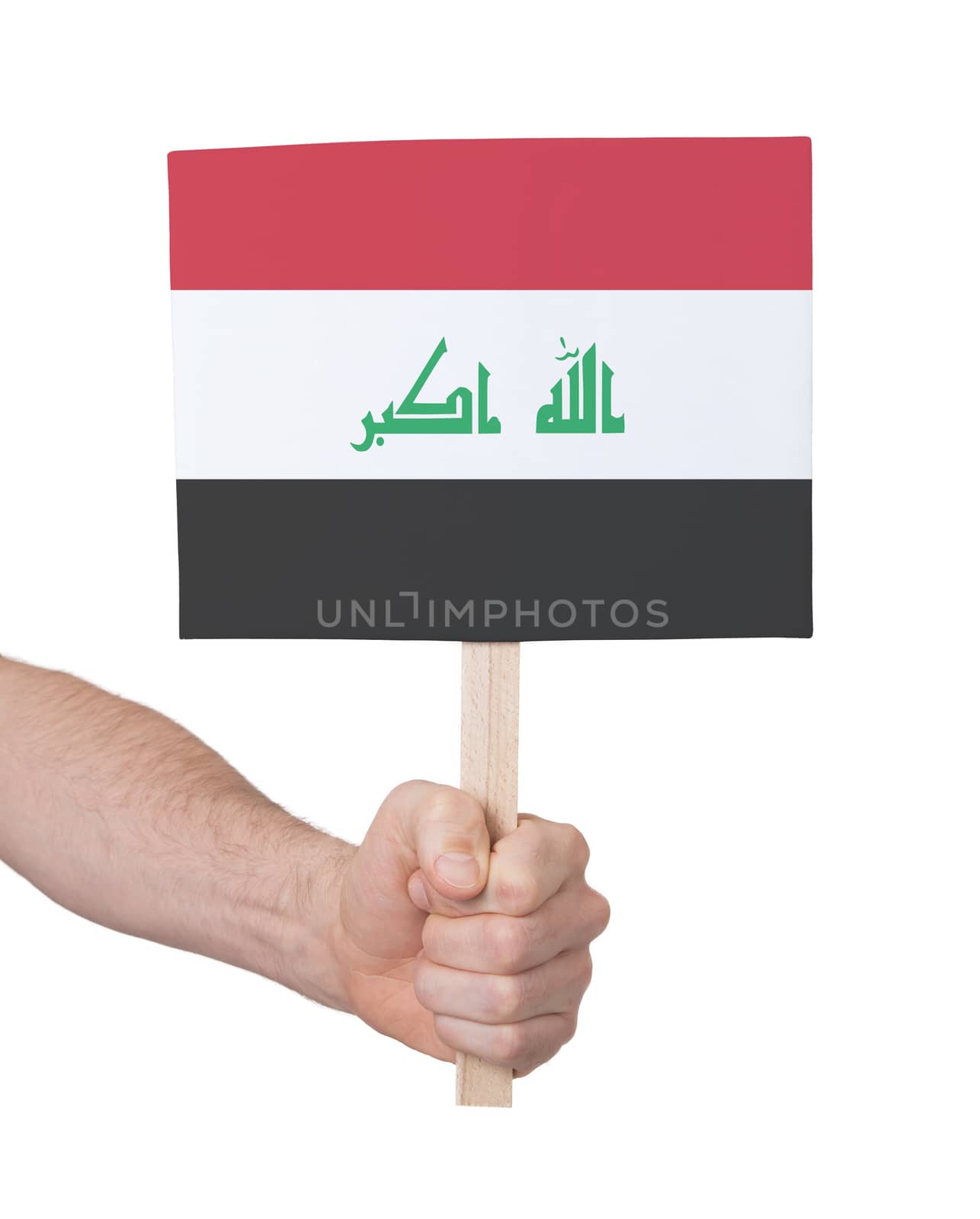 Hand holding small card, isolated on white - Flag of Iraq