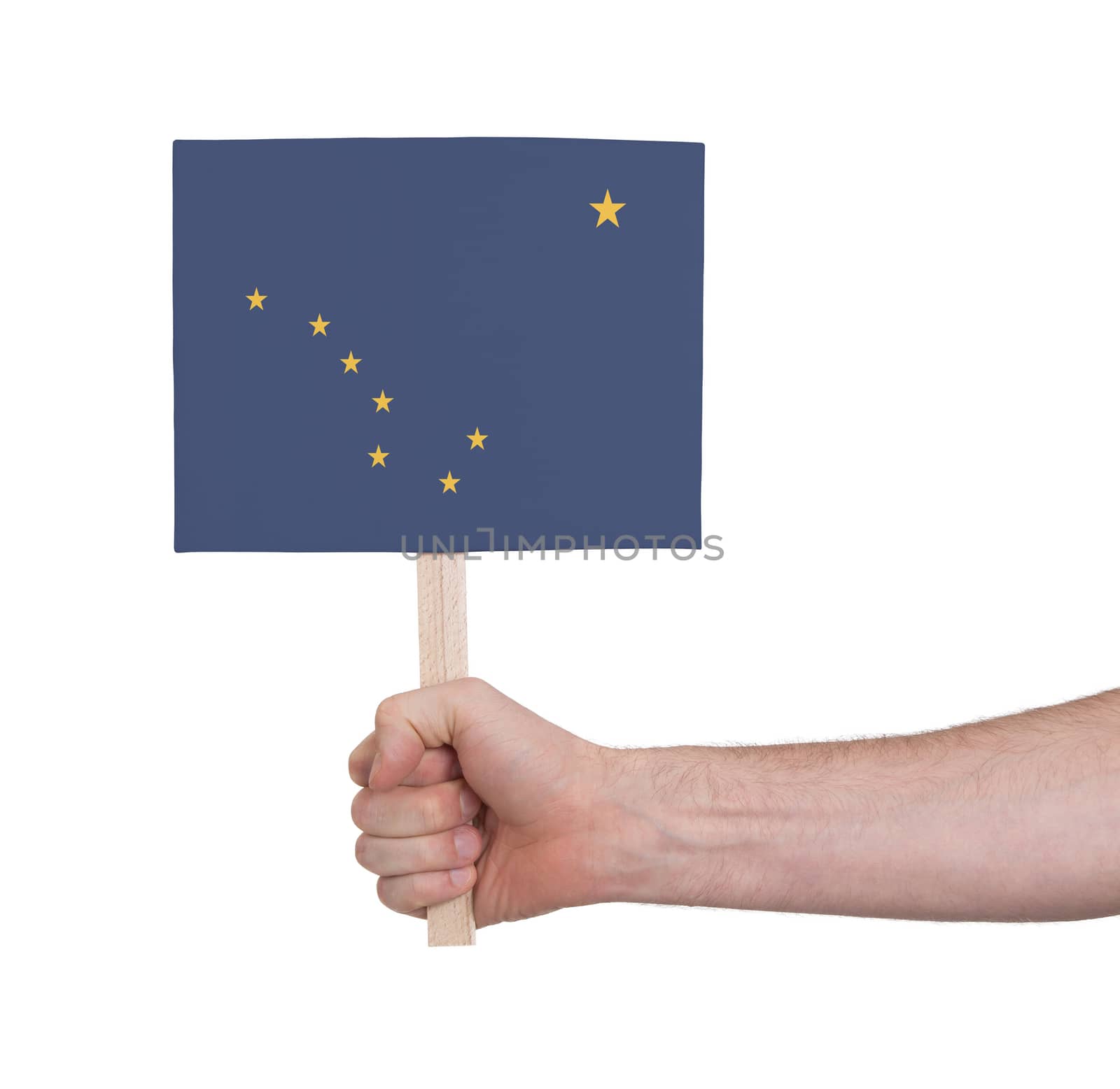 Hand holding small card - Flag of Alaska by michaklootwijk