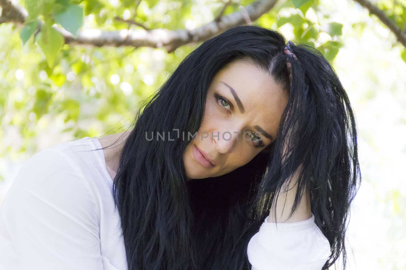 Photo of Caucasian brunette woman in white