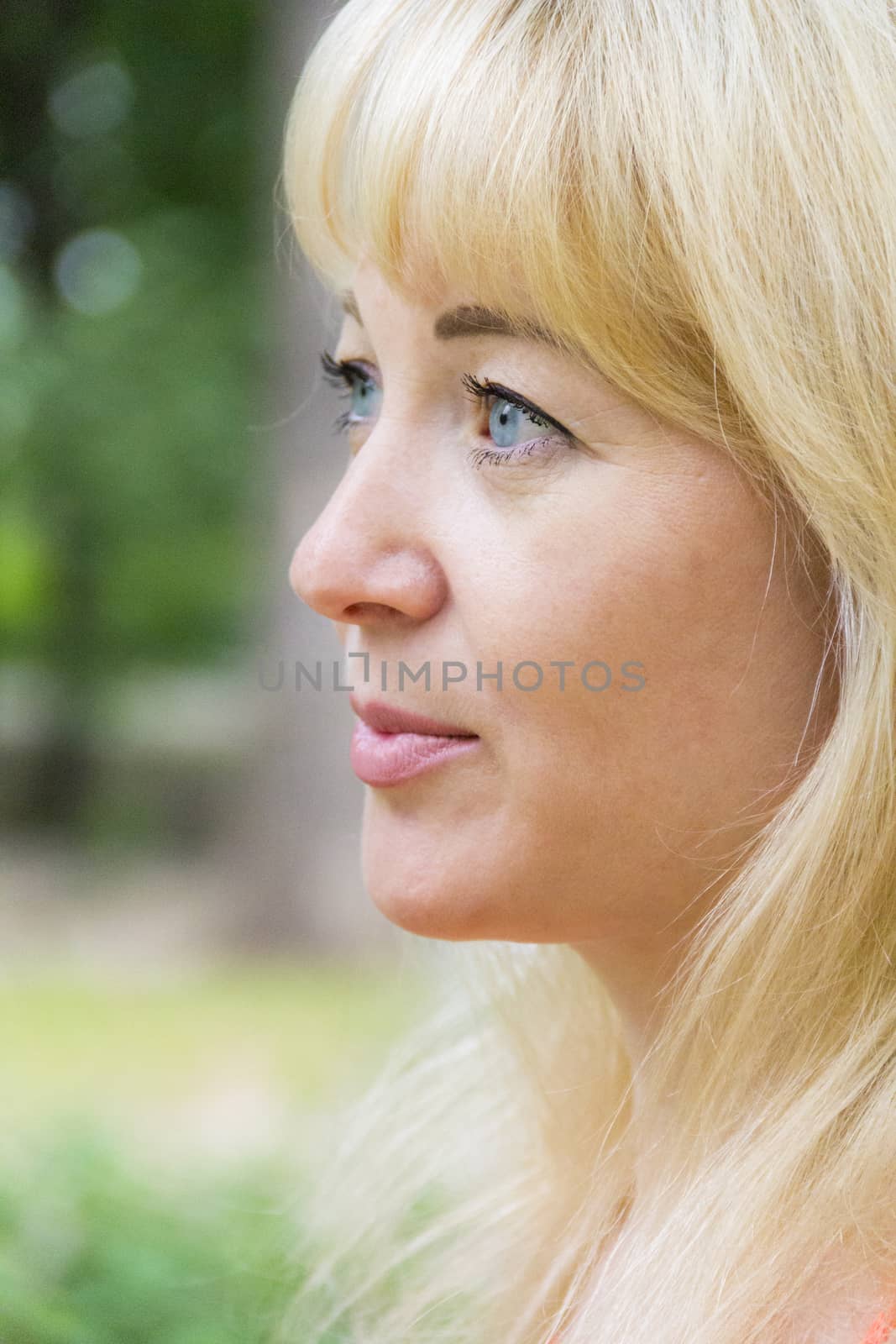 European blond woman with long hair and blue eyes