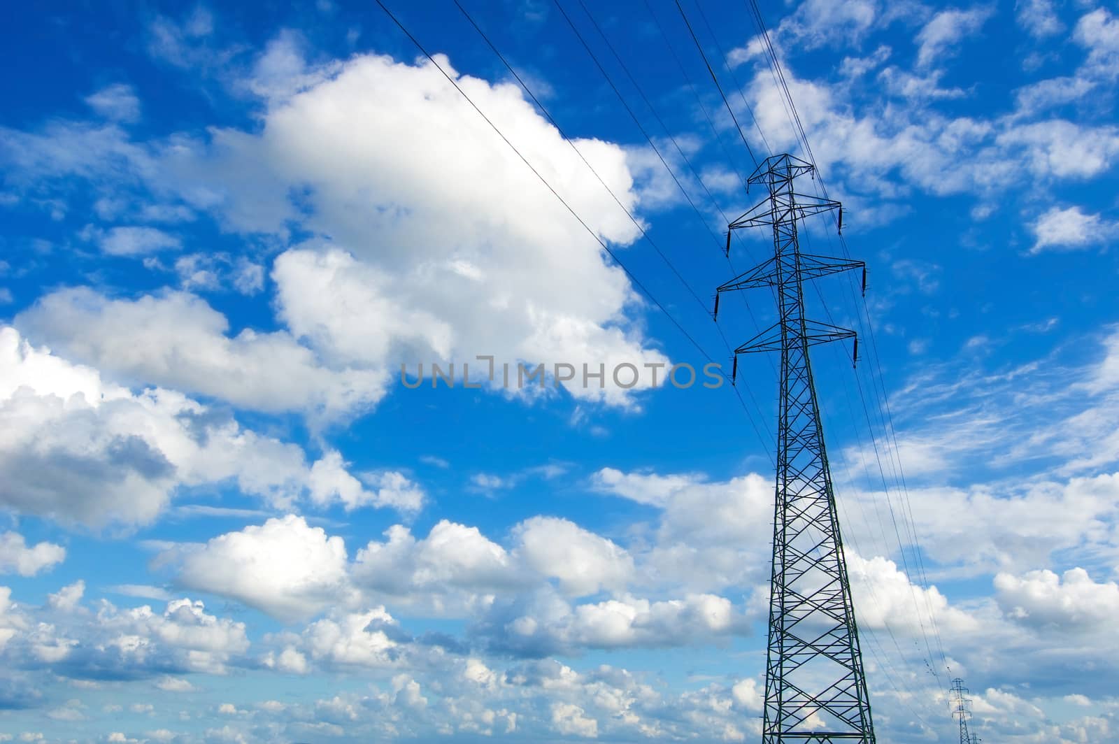 Power lines against the blue sky.