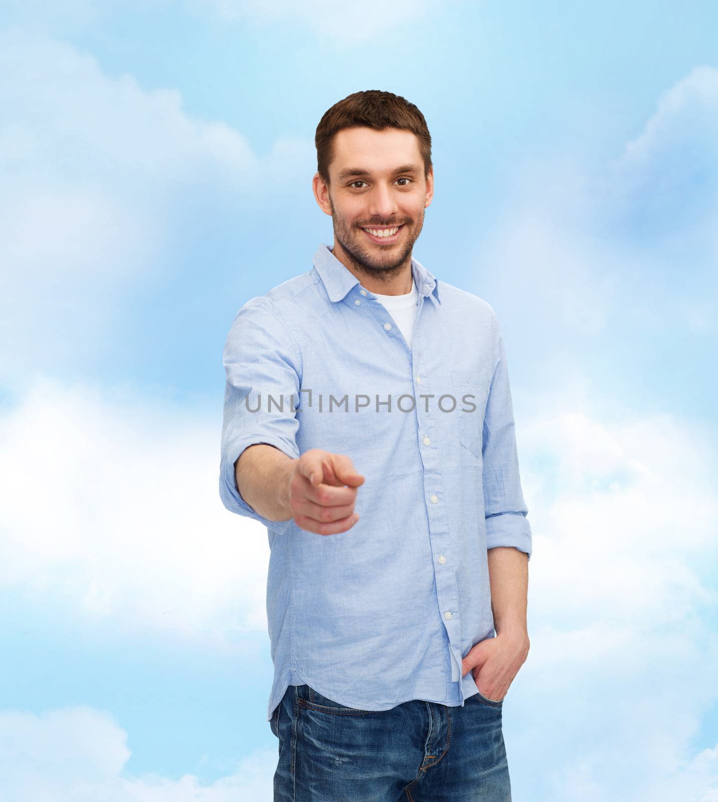 smiling man pointing finger at you by dolgachov
