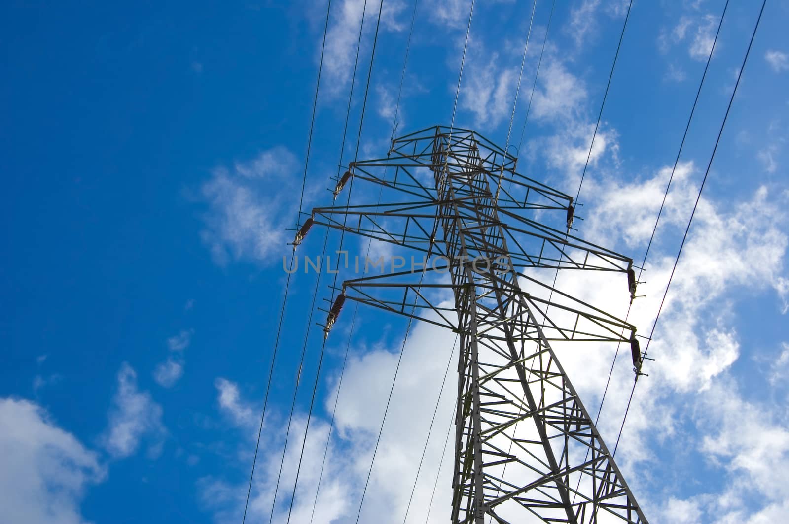 Power lines against the blue sky.