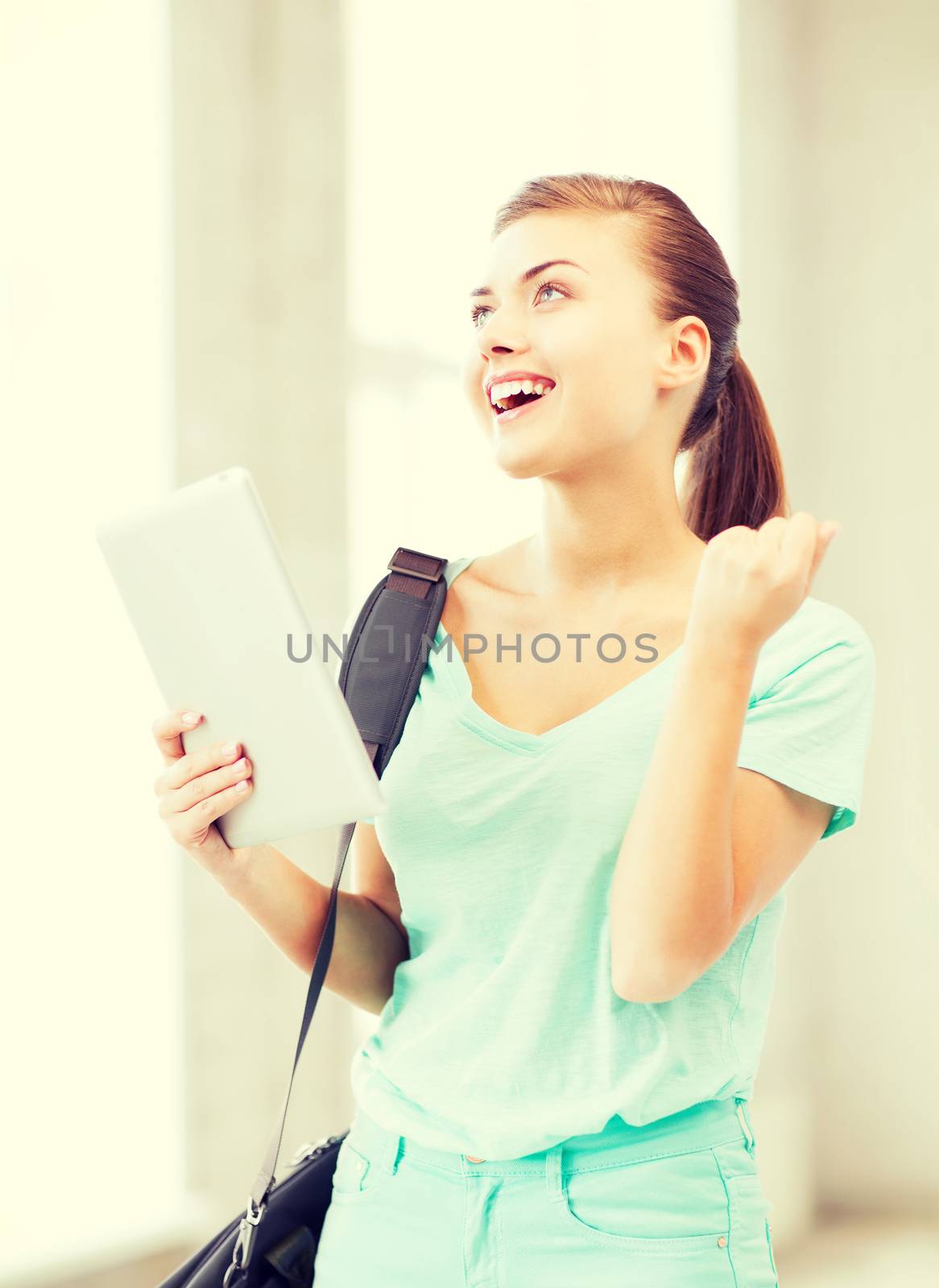 happy student girl with tablet pc by dolgachov