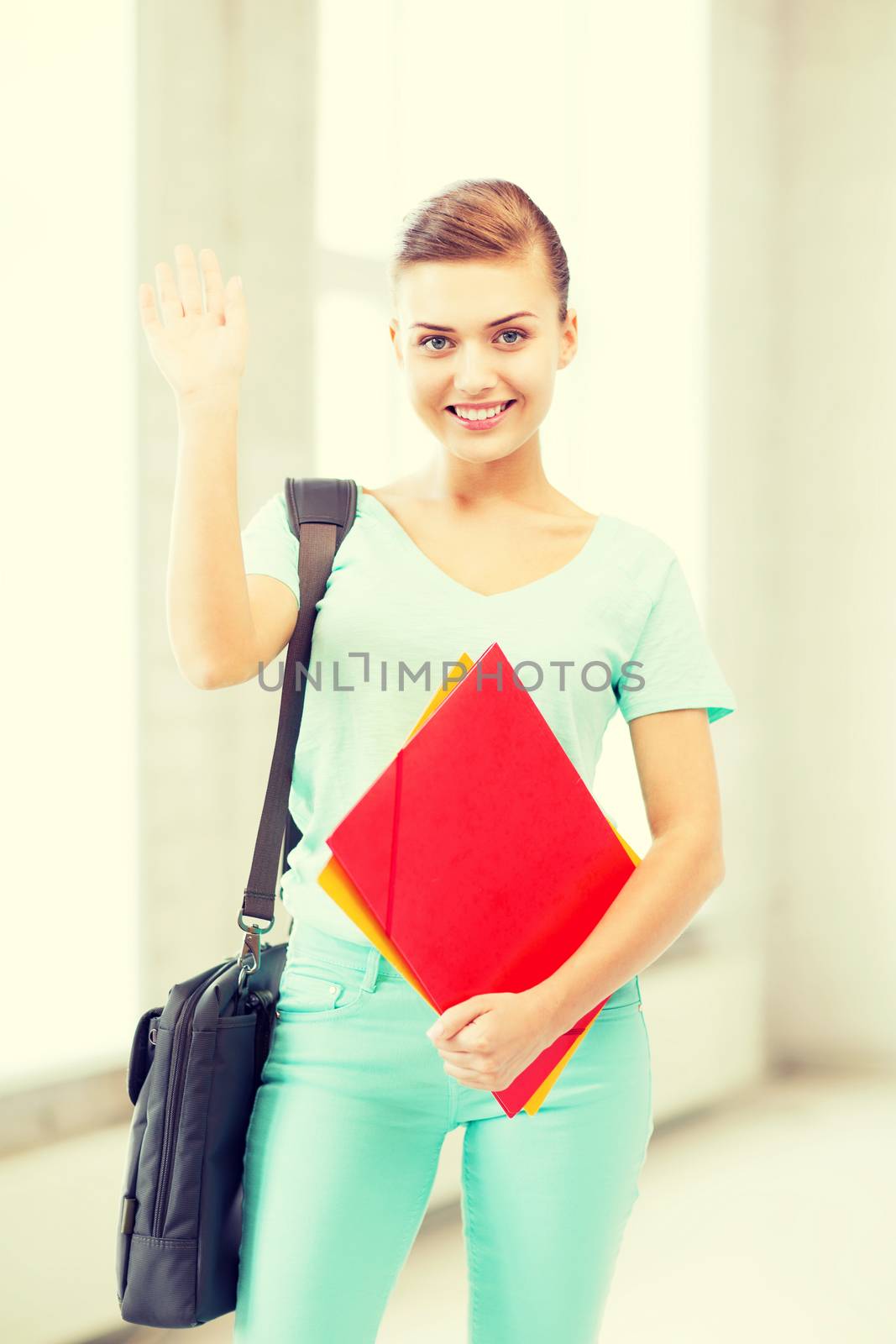 education concept - smiling student with folders and school bag in college