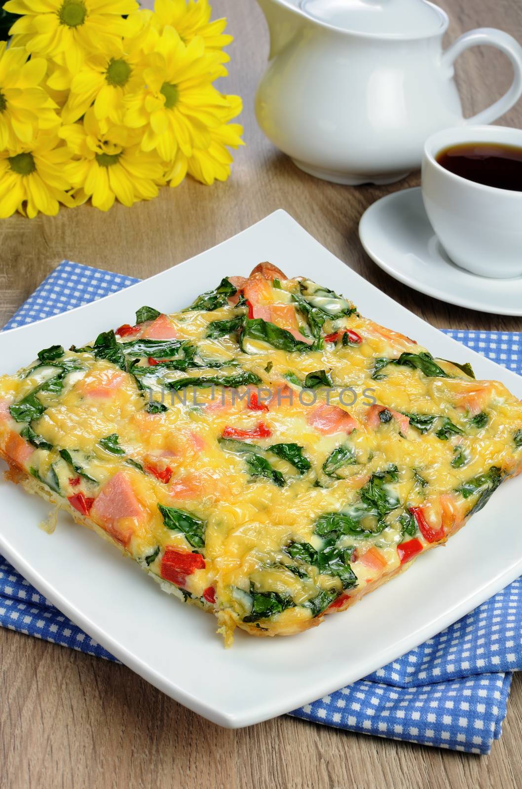 Vegetable omelet with spinach, sausage and a cup of coffee