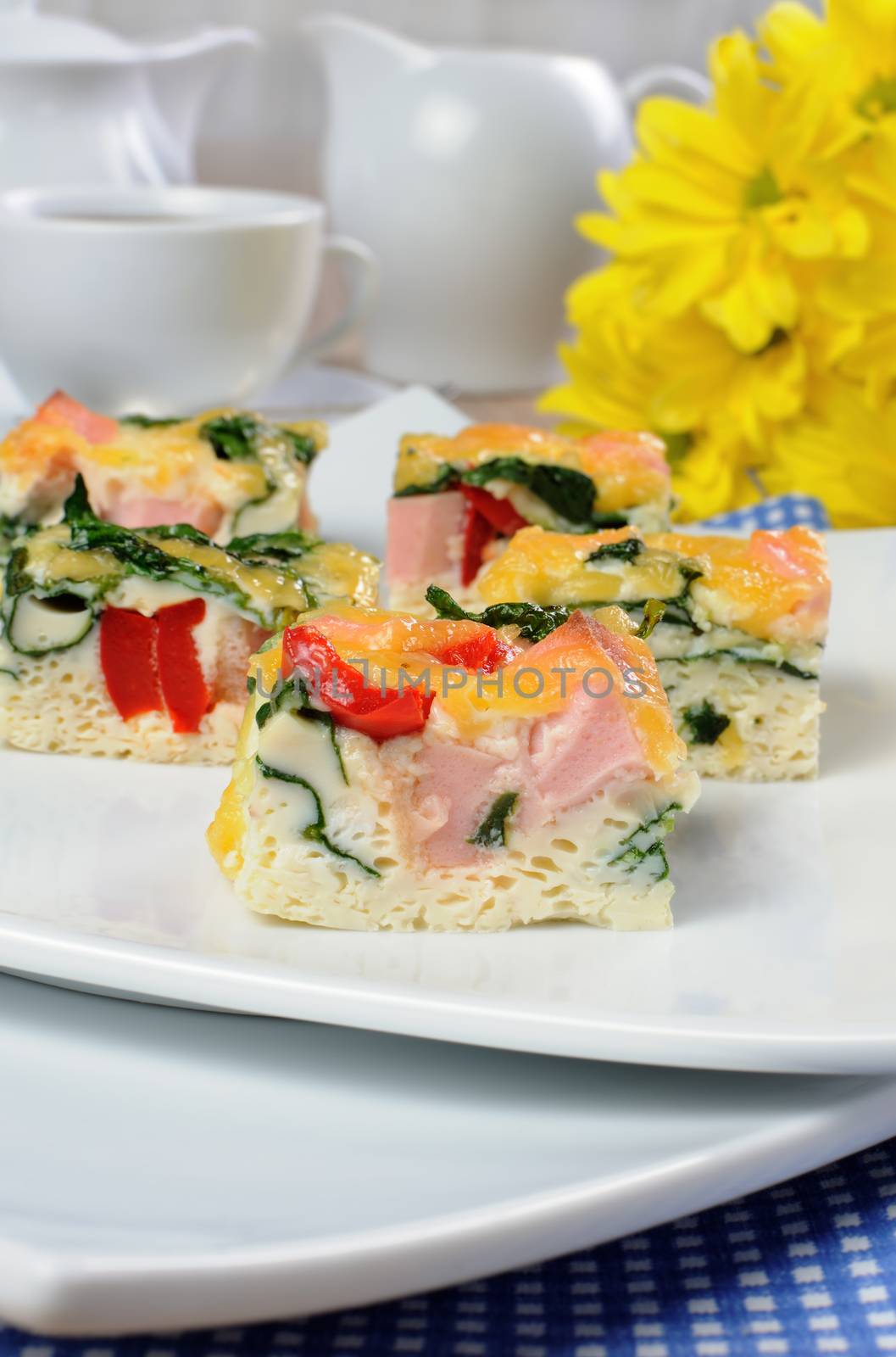 Canape of omelet with spinach, sausage and a cup of coffee