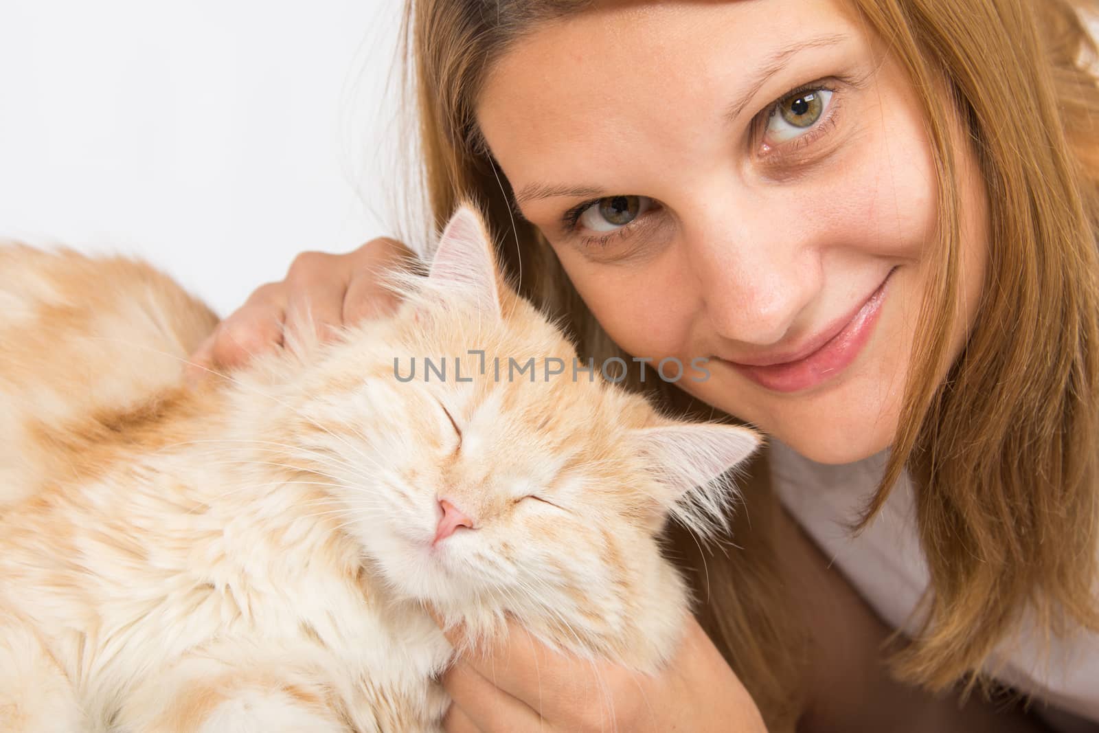 Young girl Europeans embracing his domestic cat