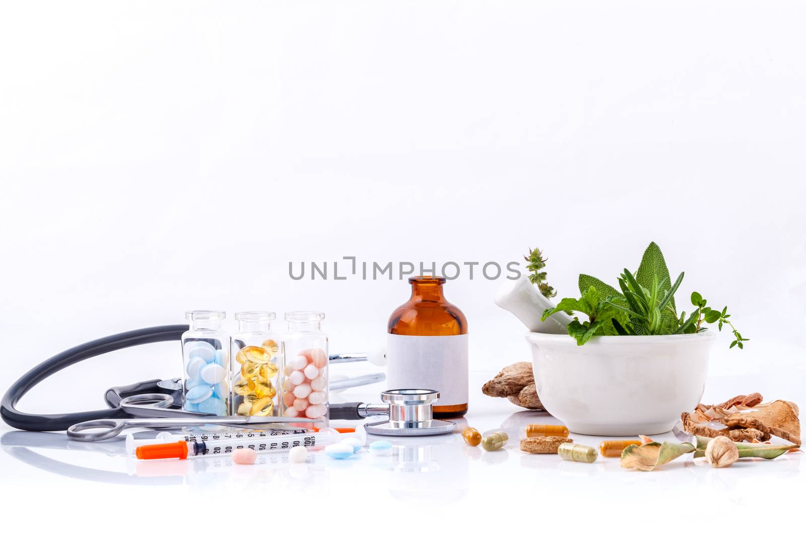Herbal medicine VS Chemical medicine the alternative healthy care with stethoscope isolate on white background.