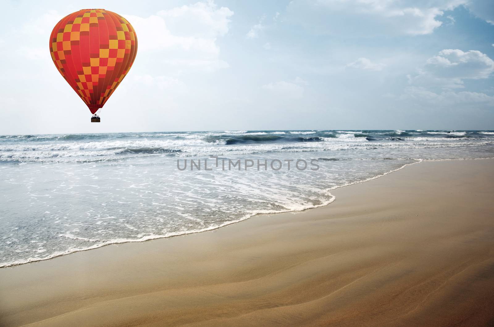 Air balloon flying over the tropical summer beach