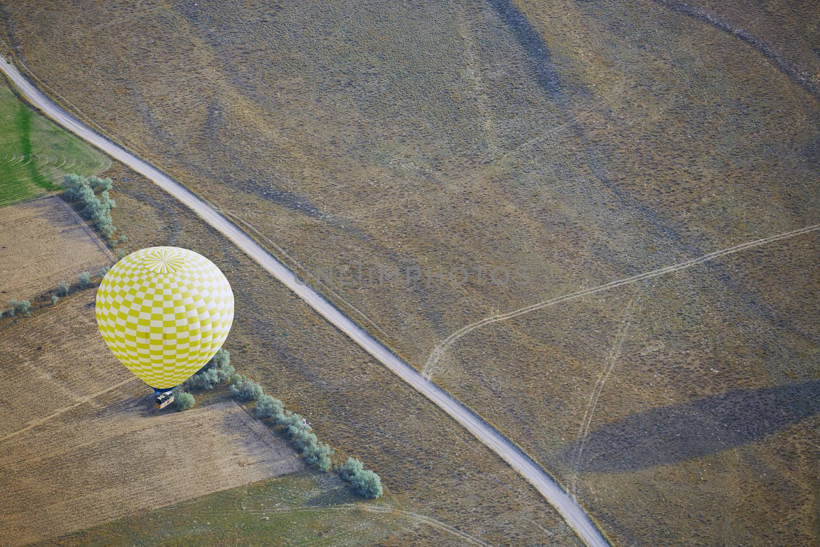 Air balloon flying above the land. Horizontal photo