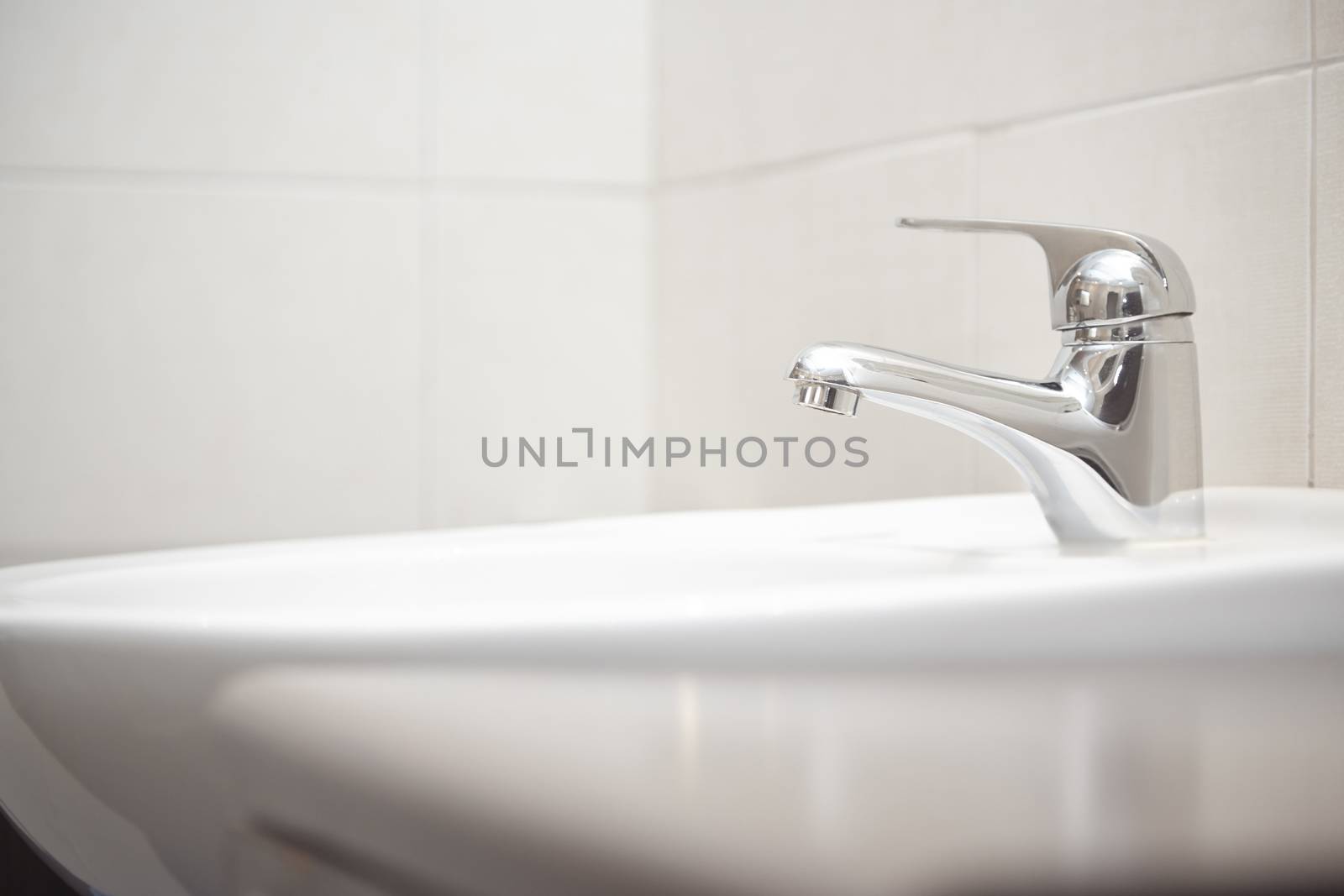 Sink with water tap. Close-up horizontal photo