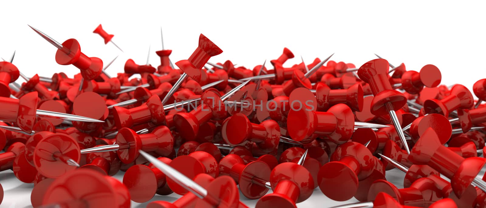 red push pins scattered over white surface by stockbp