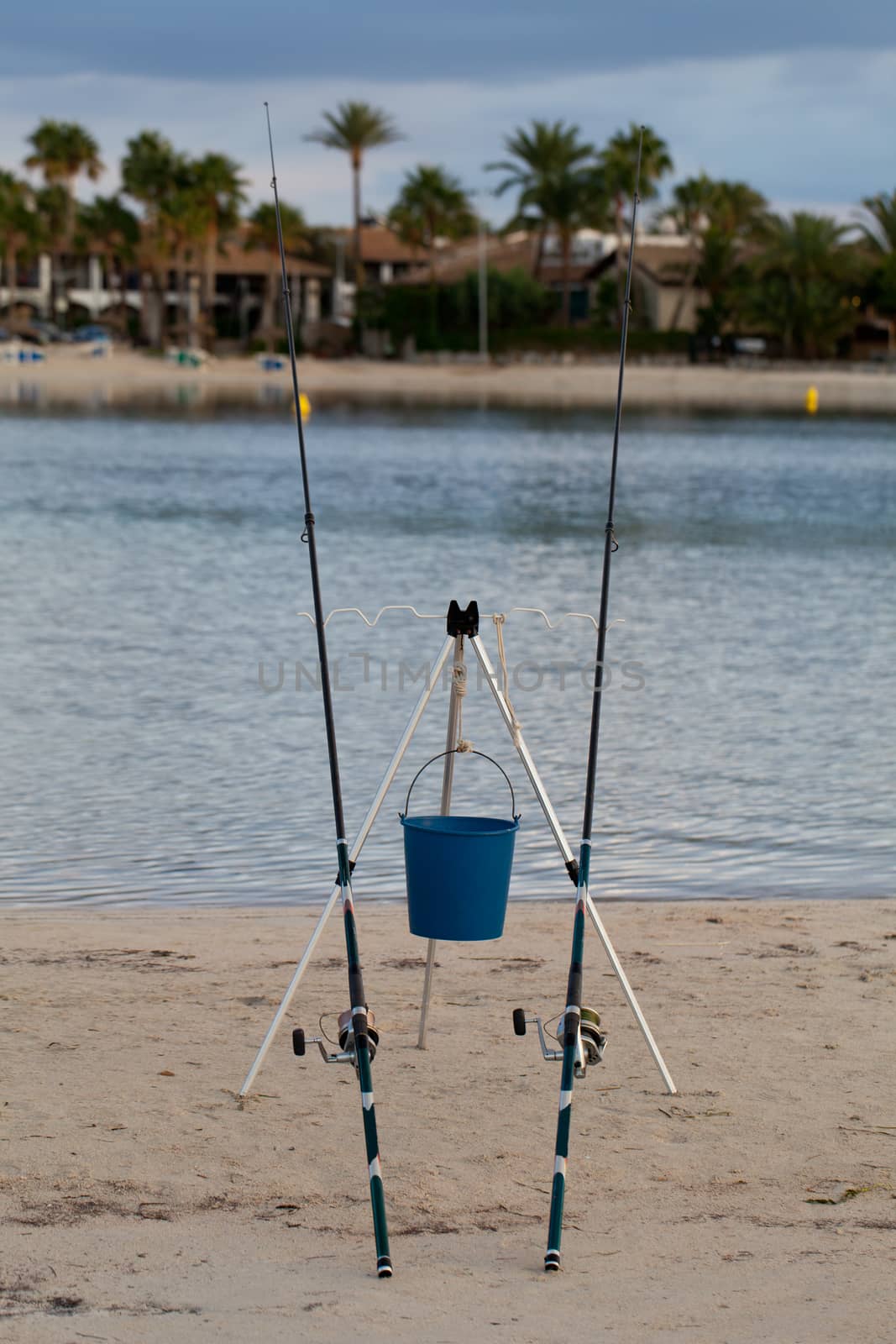 Two fishing rods at the beach in summer