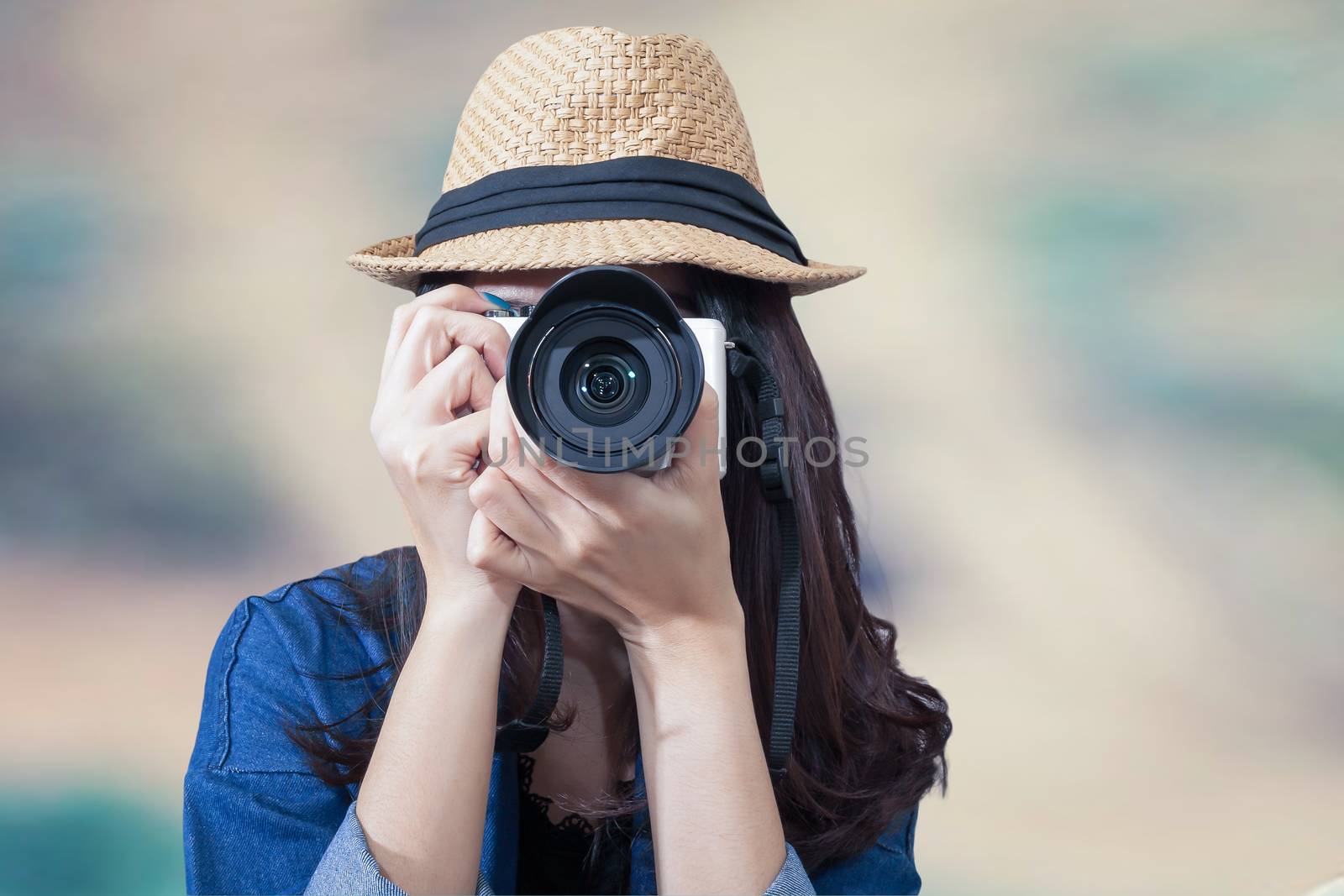 woman traveler wearing blue dress as photographer, take photo wi by FrameAngel