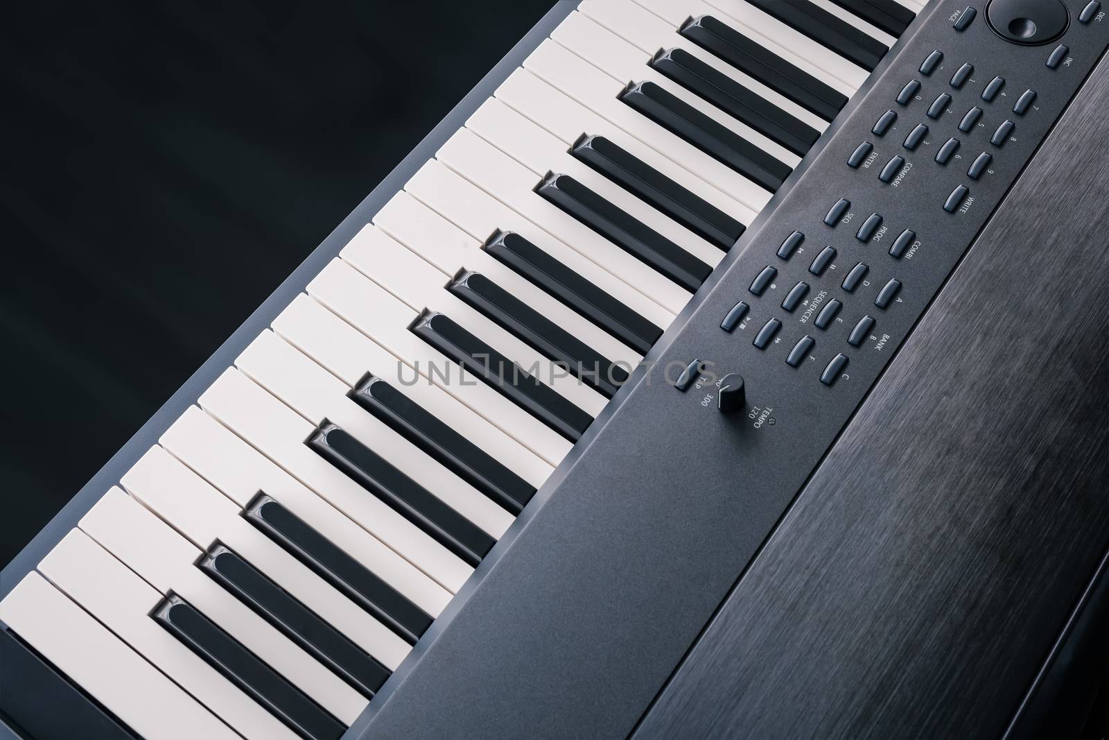 Piano Keyboard synthesizer closeup key top view by FrameAngel