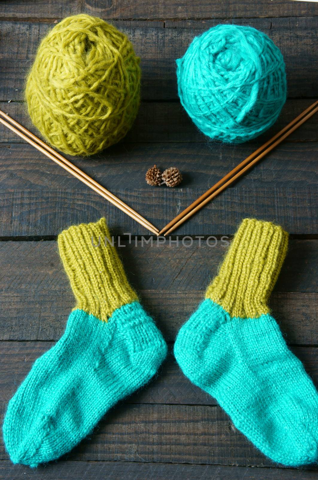 Pair of socks for winter season, knit from vibrant woollen for kid, keep foot in warm on cold day, handmade stockings, woman hand knitting with love