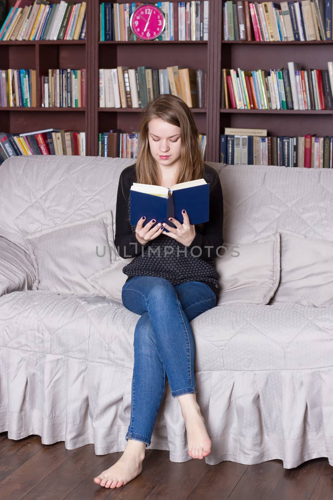 Woman at the library reading a book