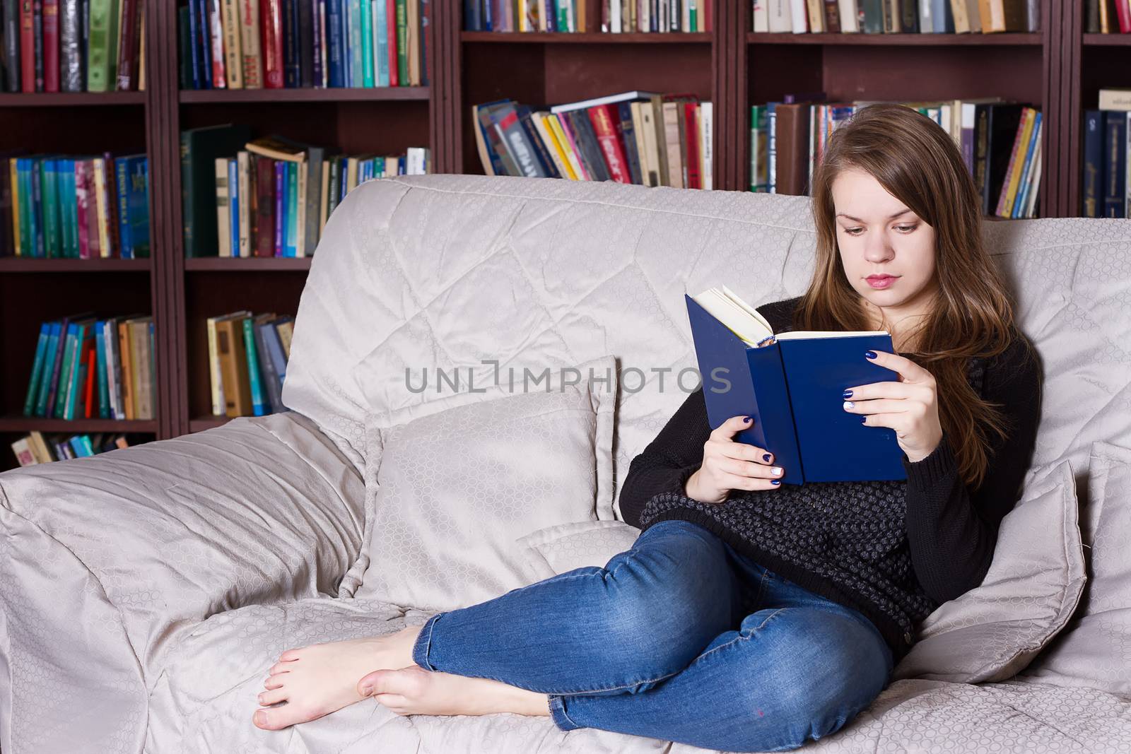 Woman at the library reading a book