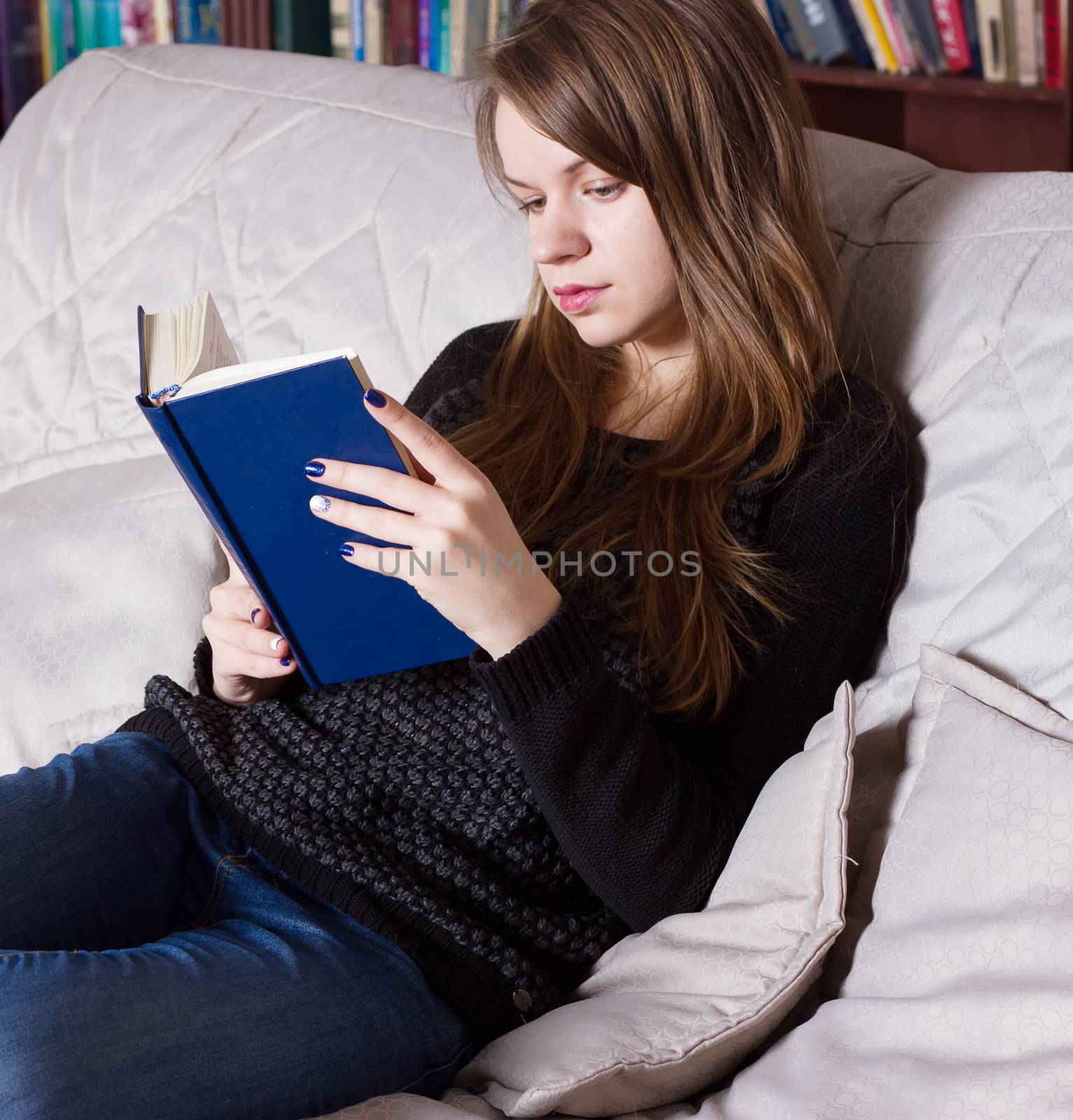 Woman at the library reading a book