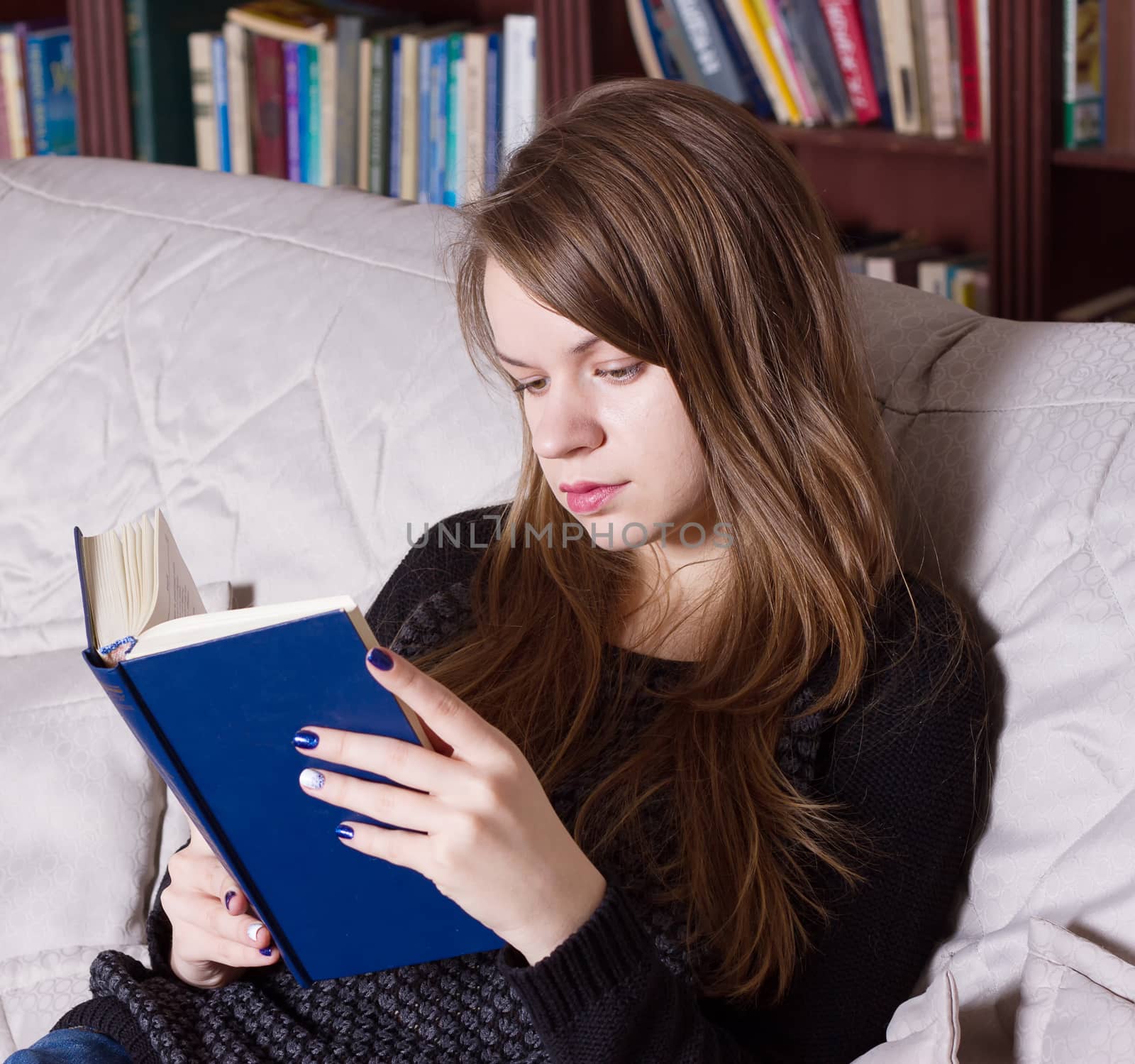 Woman at the library reading a book