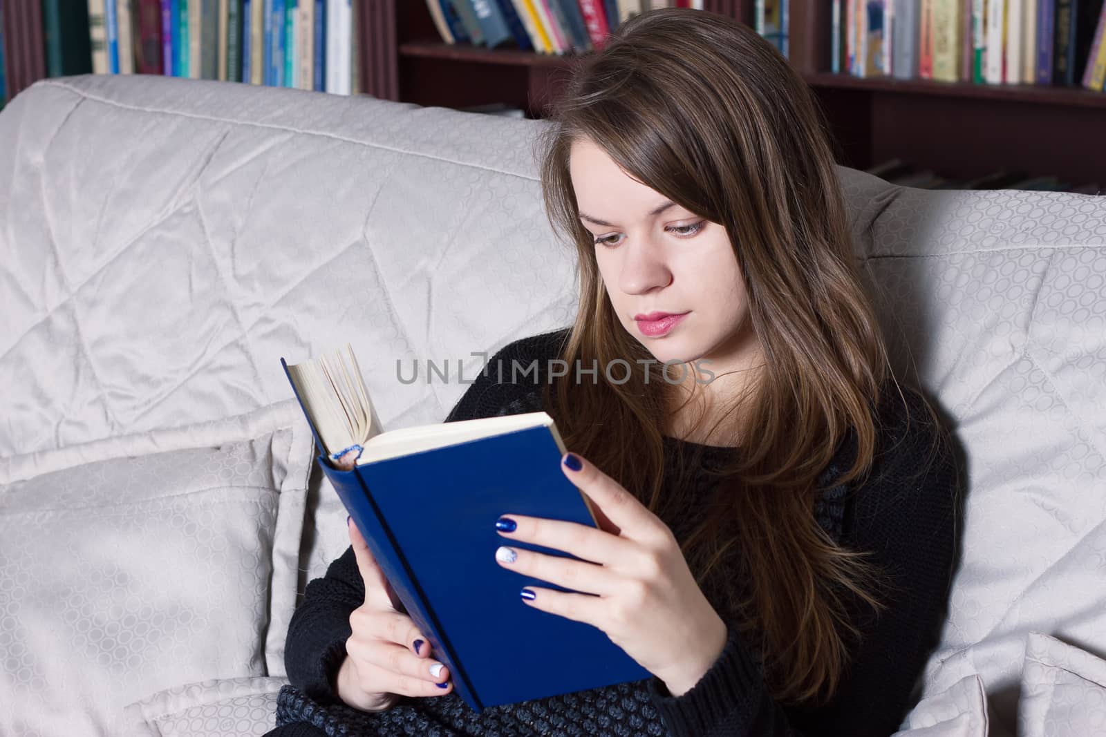 Woman at the library reading a book