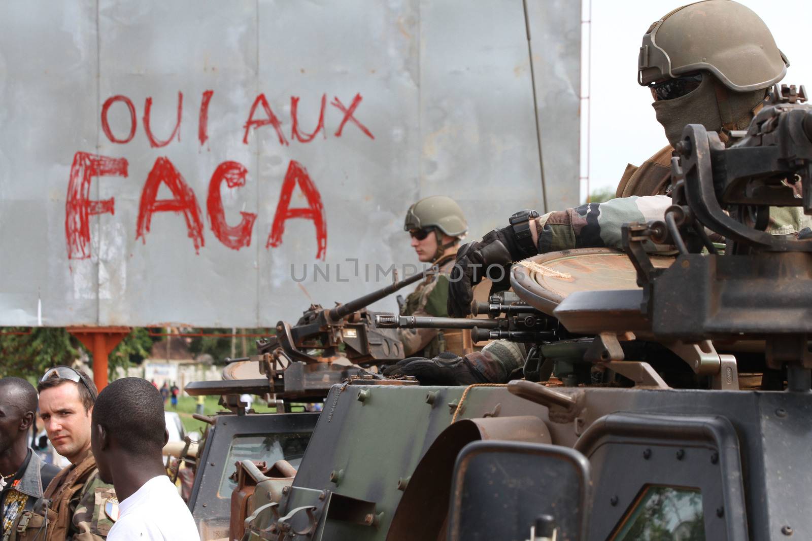 CENTRAL AFRICAN REPUBLIC, Two French Sangaris armed force soldiers stands in their tank in Bangui, as they patrols in the city, on October 2, 2015. The Central African Republic descended into bloodshed more than two years ago after long time president Francois Bozize, a Christian, was ousted by Seleka rebels, triggering the worst crisis since independence in 1960. On September 29, 2015, Bangui returned to only relative calm after three days of inter-community violence which left at least 40 dead and 100 injured according to the UN Refugee Agency UNHCR. Some 27,000 inhabitants of Bangui have also fled to displaced people's camps.