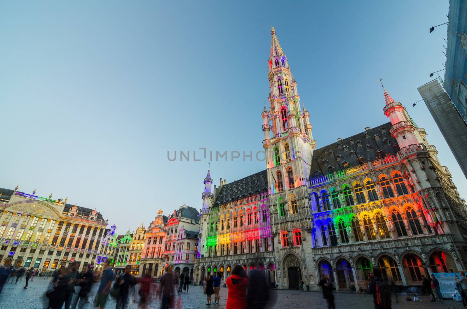 Brussels, Belgium - May 13, 2015: Tourists visiting famous Grand Place (Grote Markt) the central square of Brussels. The square is the most important tourist destination and most memorable landmark in Brussels.