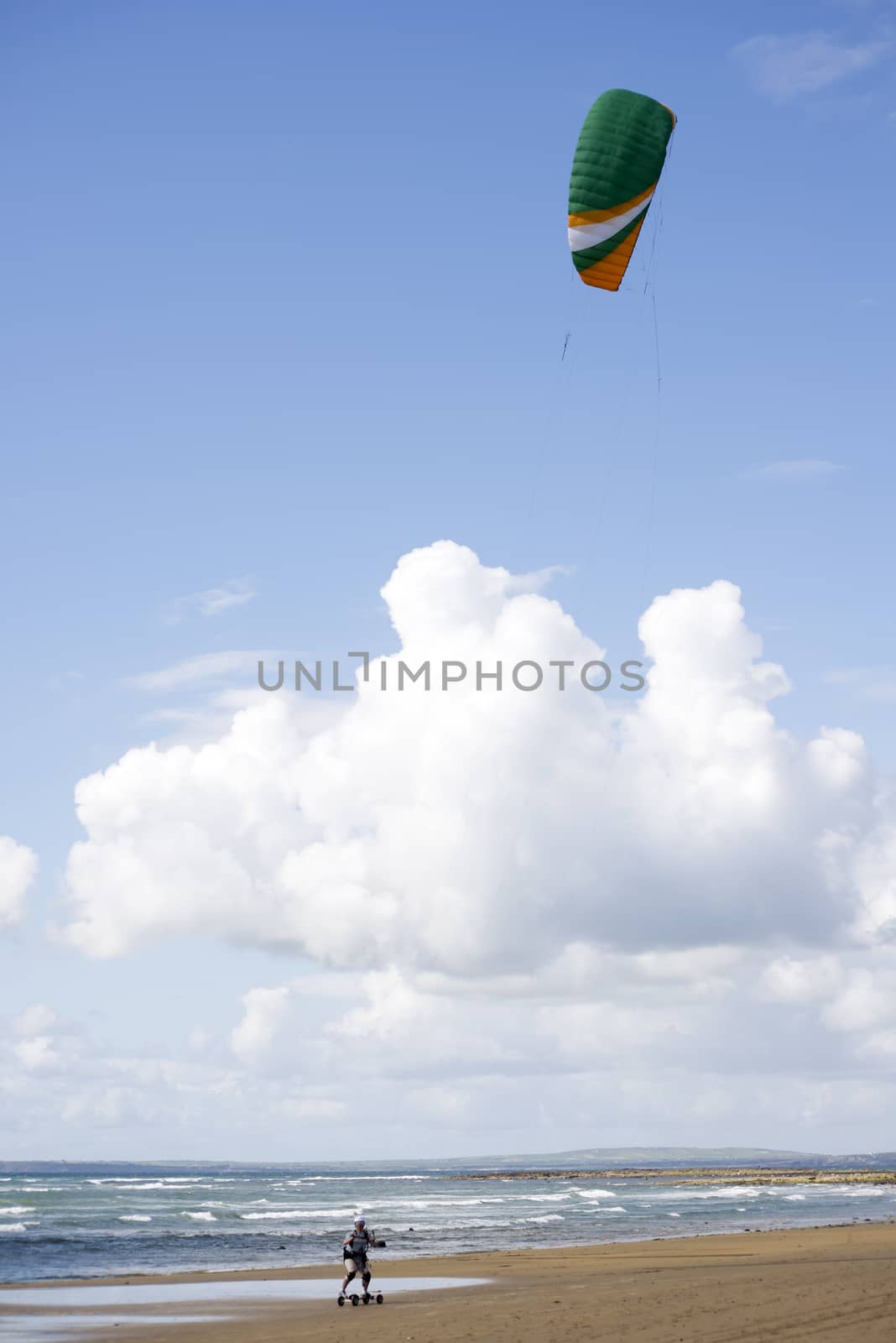 kite boarder on beautiful sandy beach in ballybunion county kerry ireland