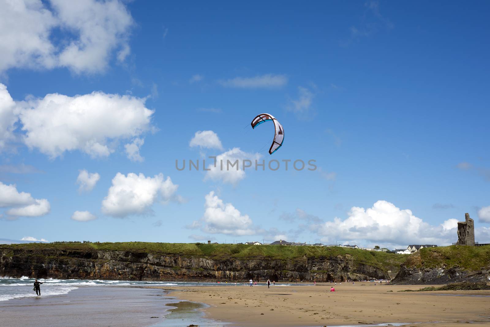 lone kite surfer getting ready at ballybunion beach on the wild atlantic way