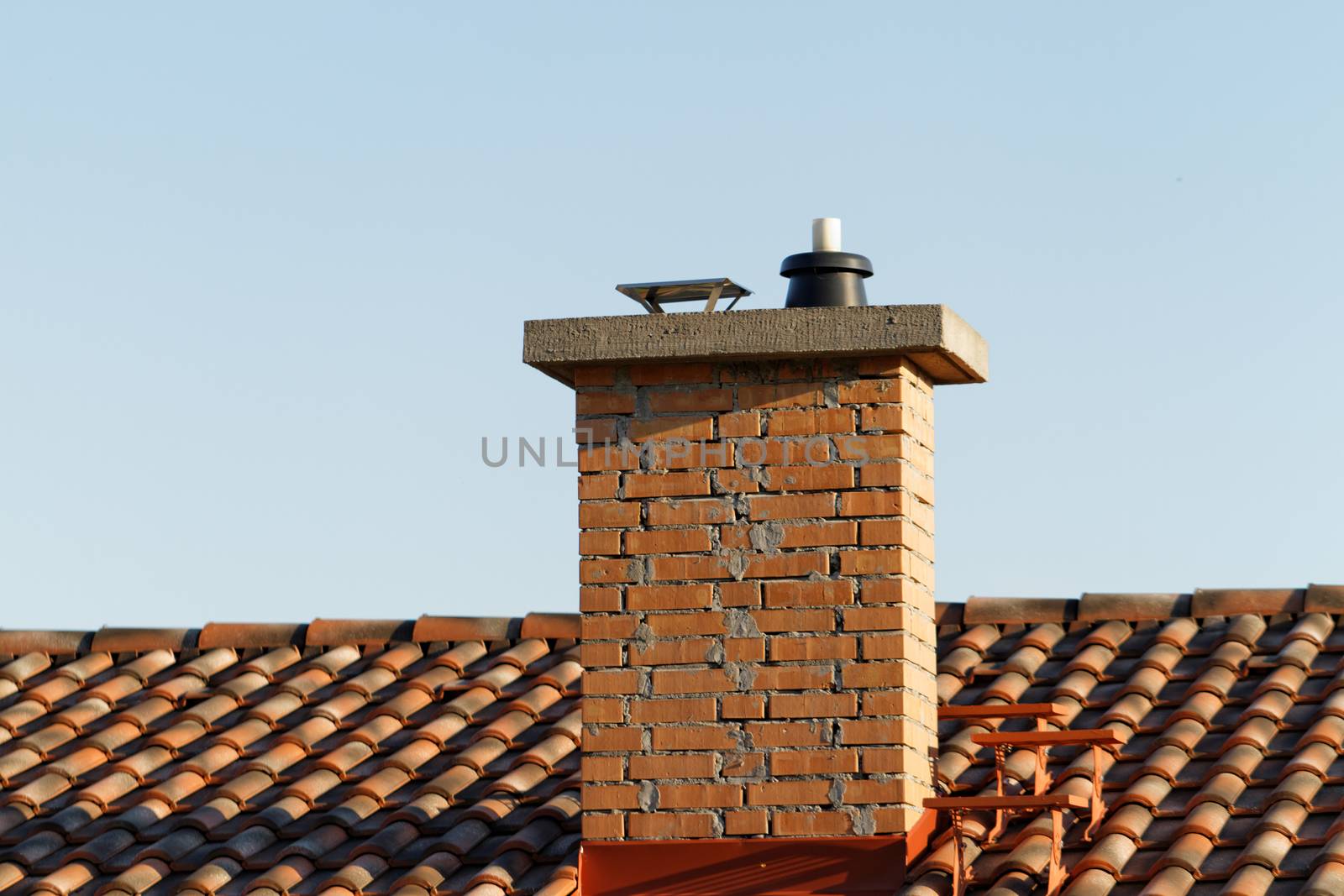 Photo of the chimney on the house roof