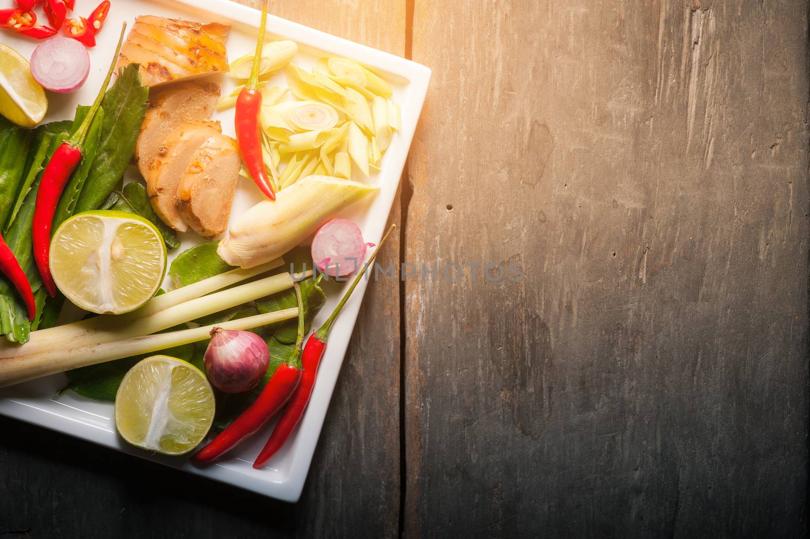 Ingredients for Thai spicy soup (Tom-yum) on wood table with morning low key scene