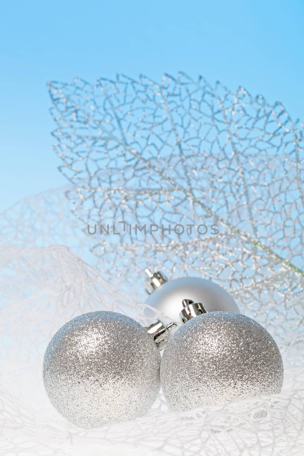 New Year background with three silver glass toys