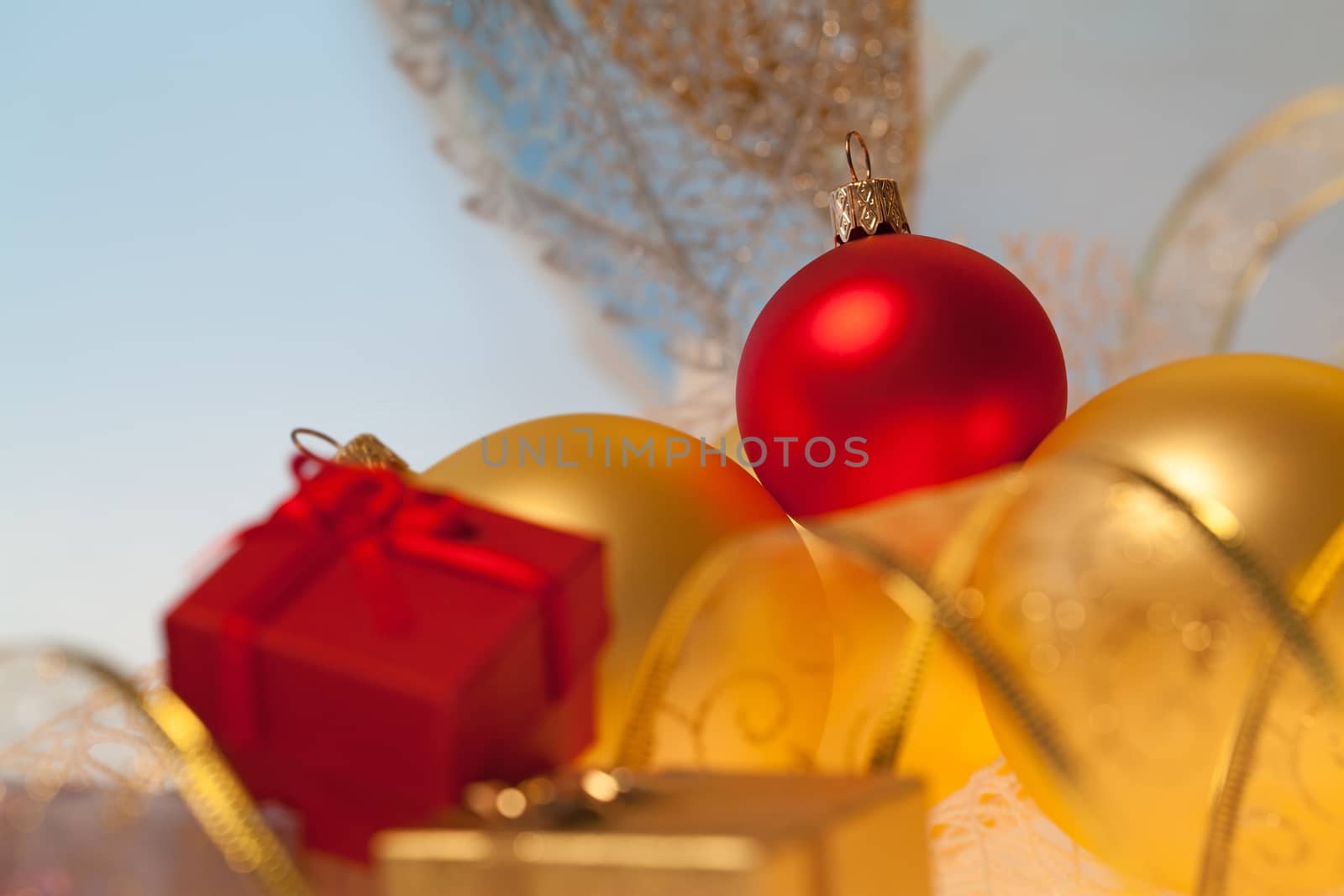 New Year background with golden ribbon, glass toys and presents