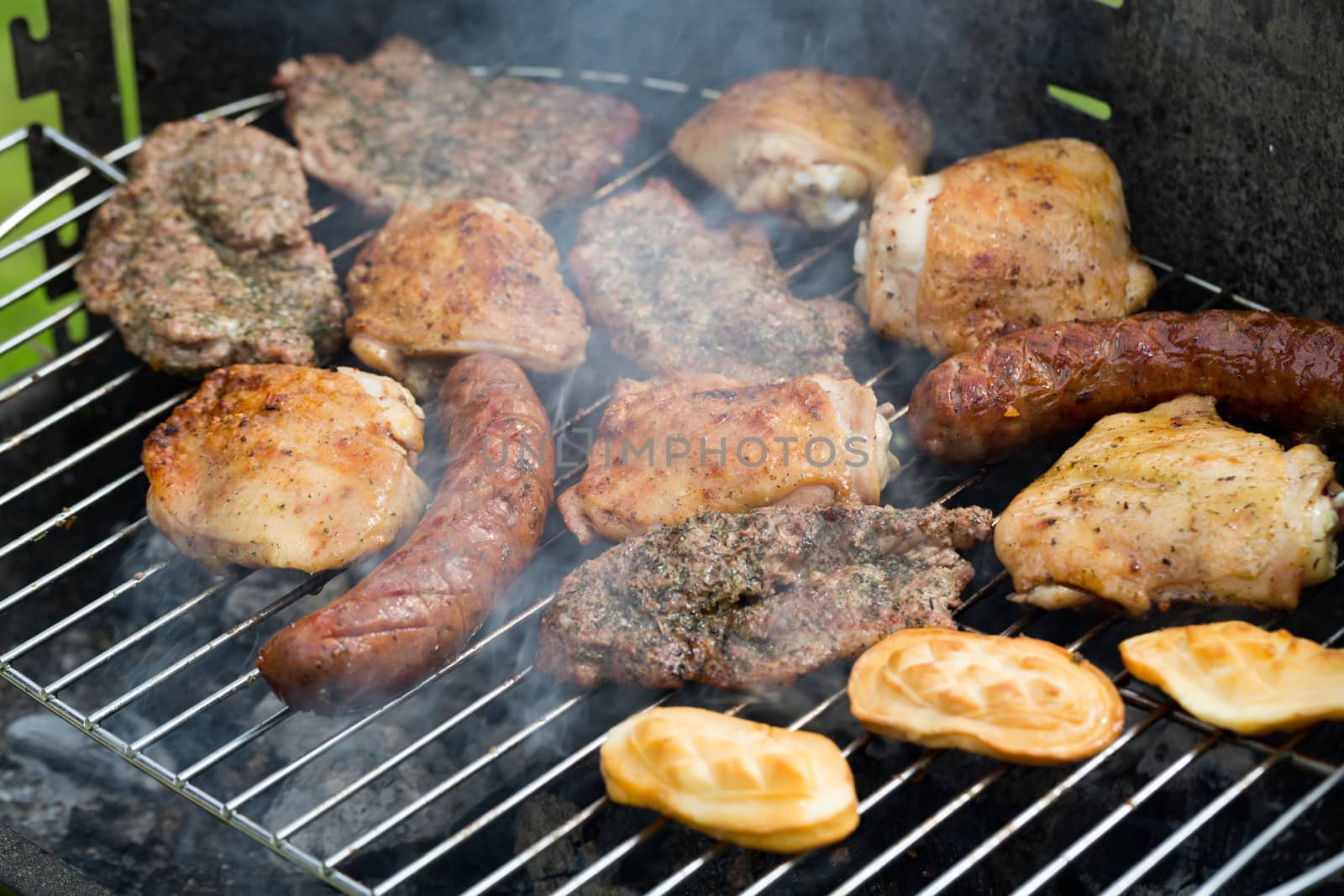 barbecue with delicious grilled meat on grill  by wjarek