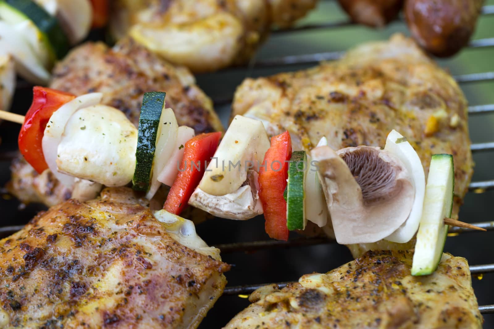 barbecue with delicious grilled meat and vegetables on grill 