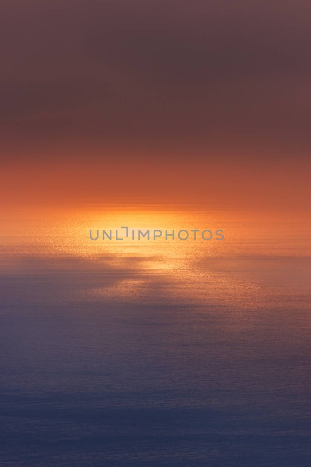 Sunlight reflecting off water. Scenic view of sunset over sea seen from a cruiser. Suitable for background.