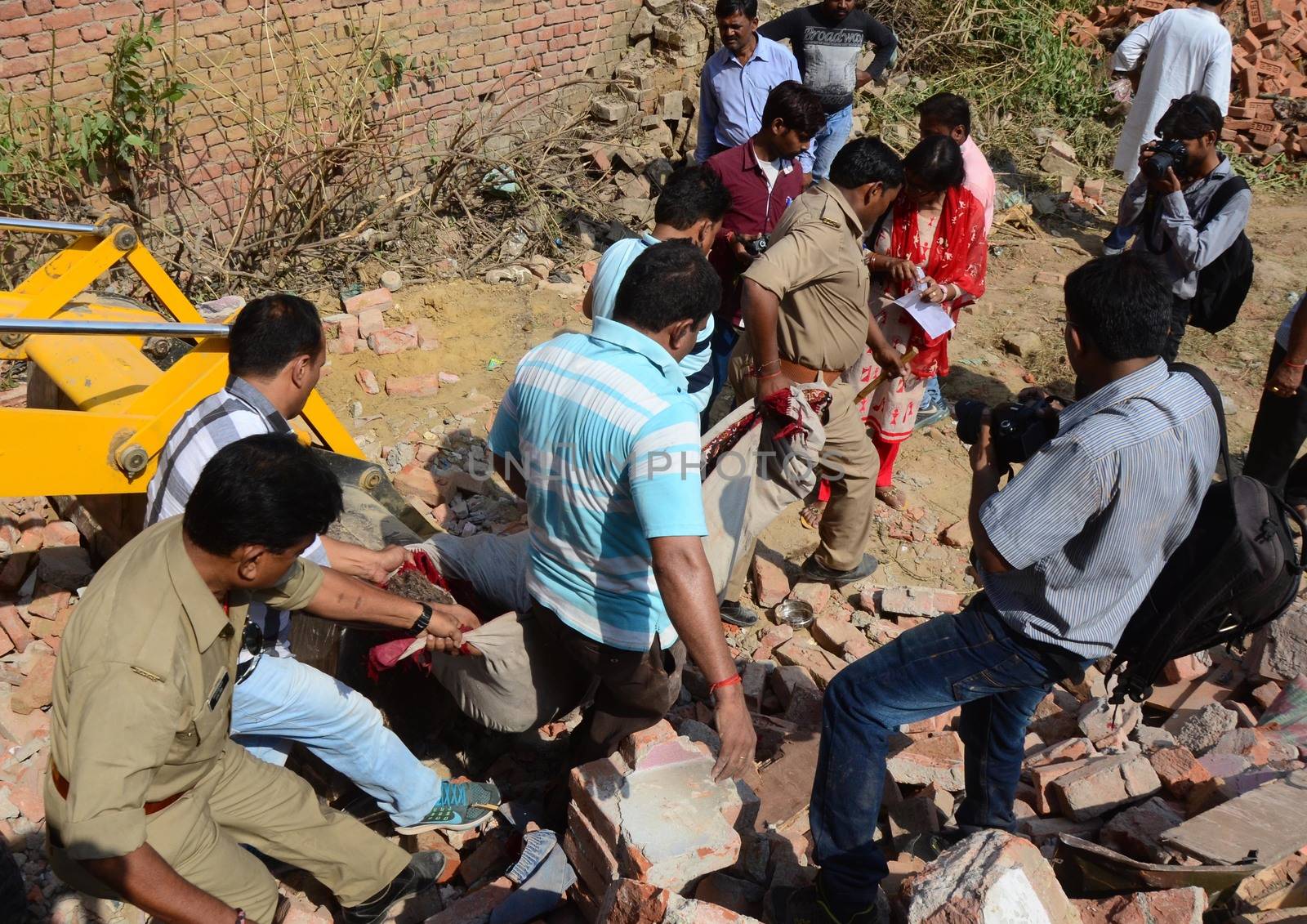 INDIA, Allahabad: Police recover dead bodies from the debris of two houses which collapsed on October 6, 2015, after an explosion at a firecracker factory. According to our contributor on the ground, the firecracker factory was operating illegally.