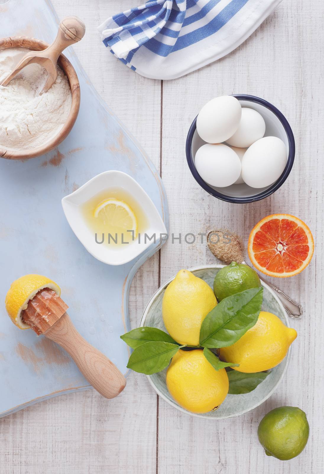 Ingredients for lemon and orange pie on wooden table, vintage style, top view. Natural light