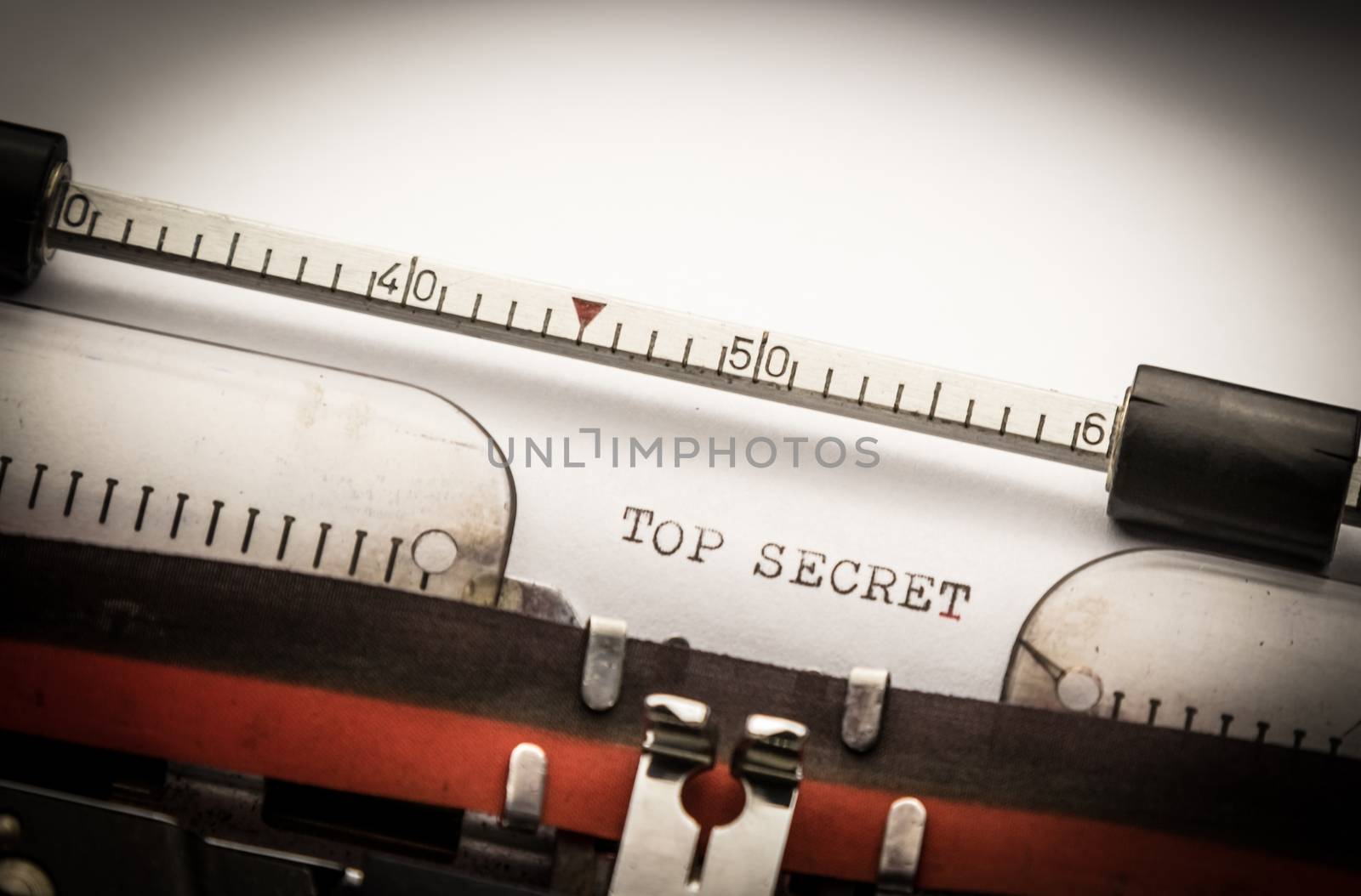 Top secret text on typewriter, concept of investigation