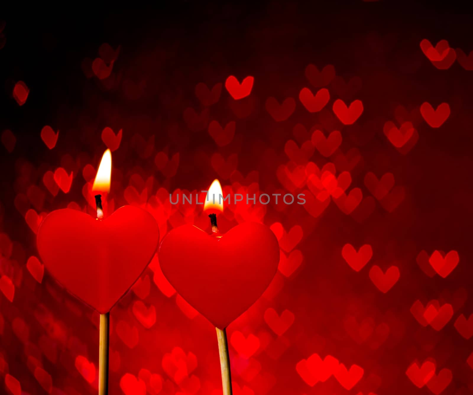 red hearts candles on red hearts bokeh as background, valentine day and love concept