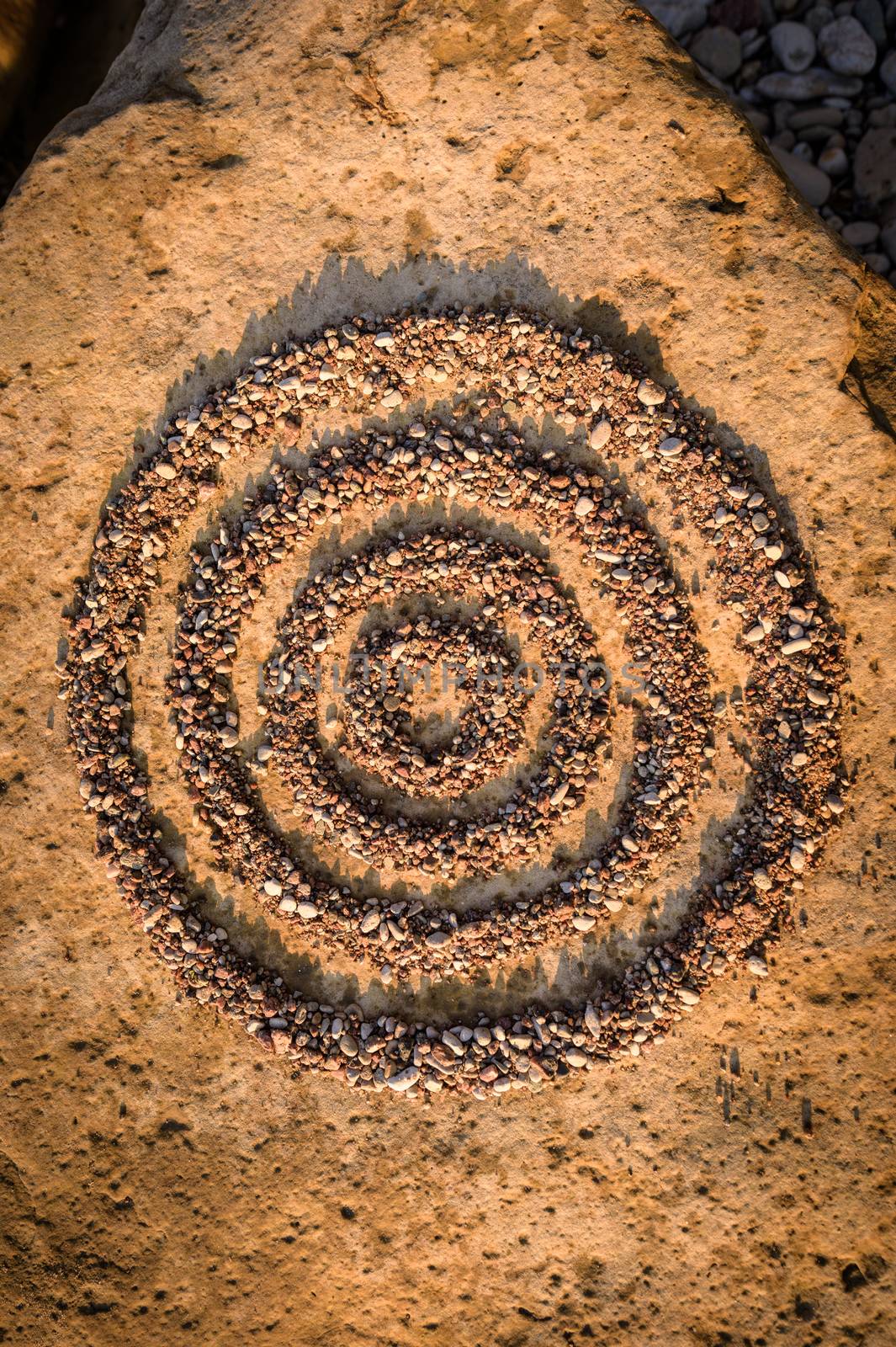 Concentric circles of small stones by styf22