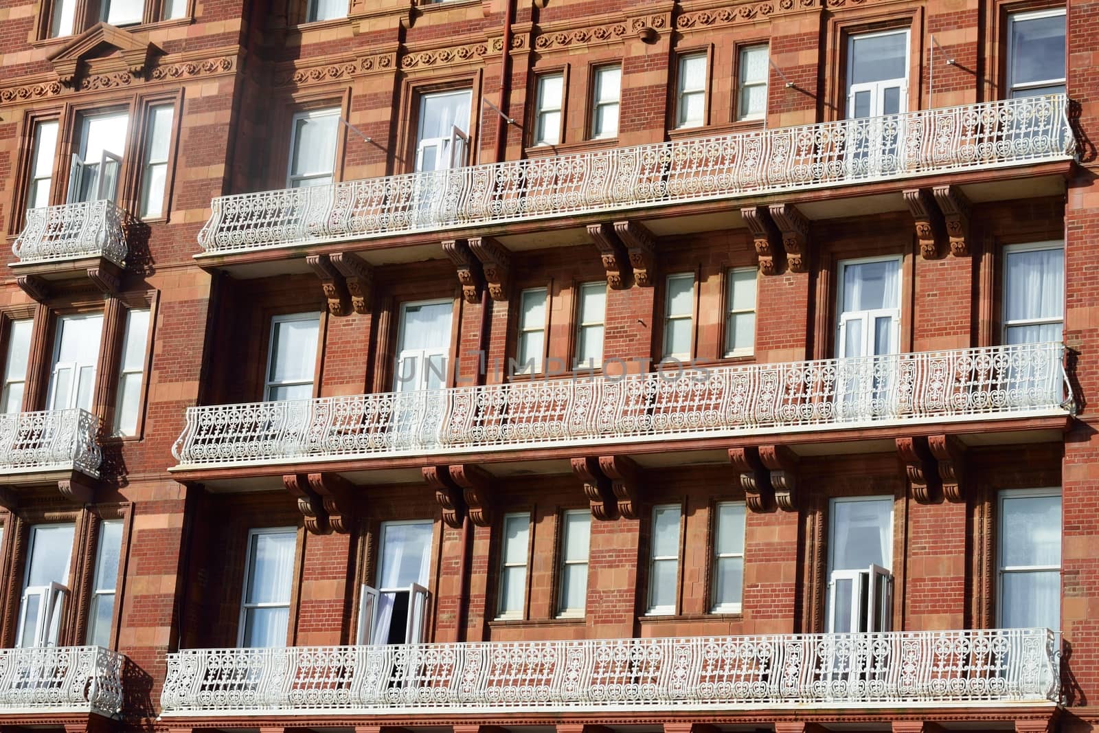 red bricked hotel with white balcony by pauws99