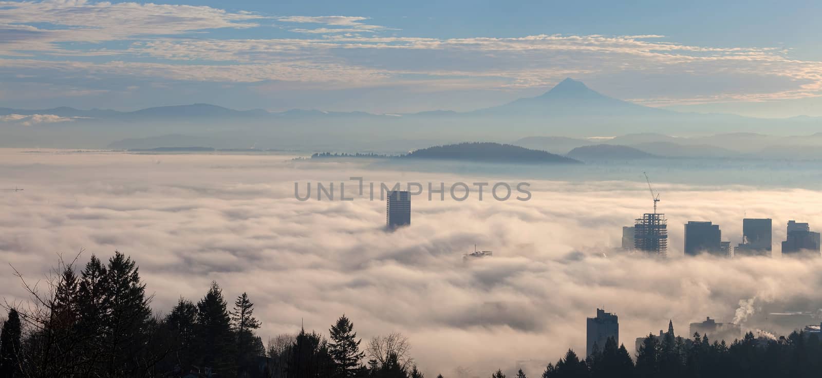 Portland Oregon downtown cityscape with Mount Hood covered in Low Fog during Sunrise Panorama