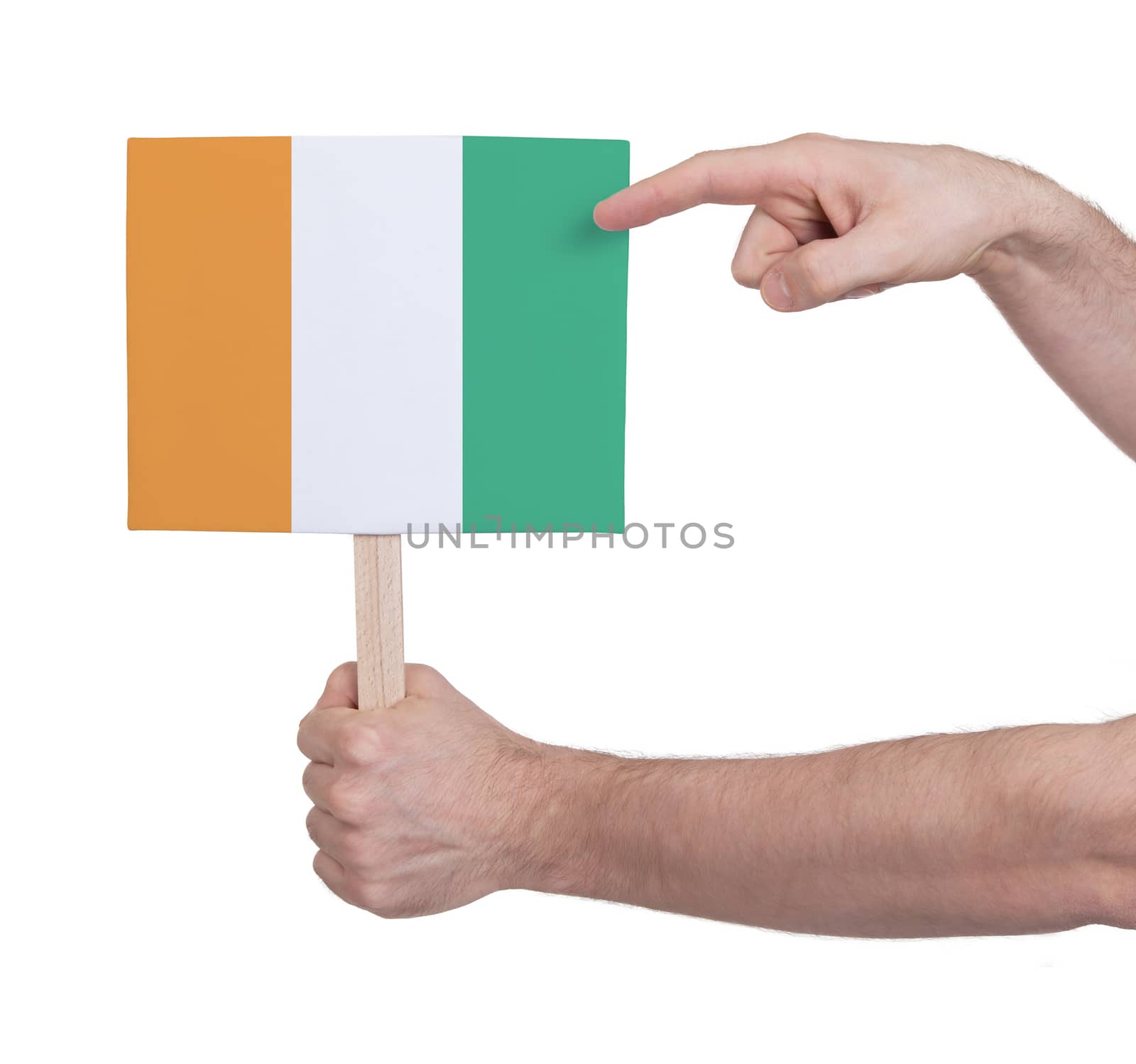 Hand holding small card - Flag of Ivory Coast by michaklootwijk