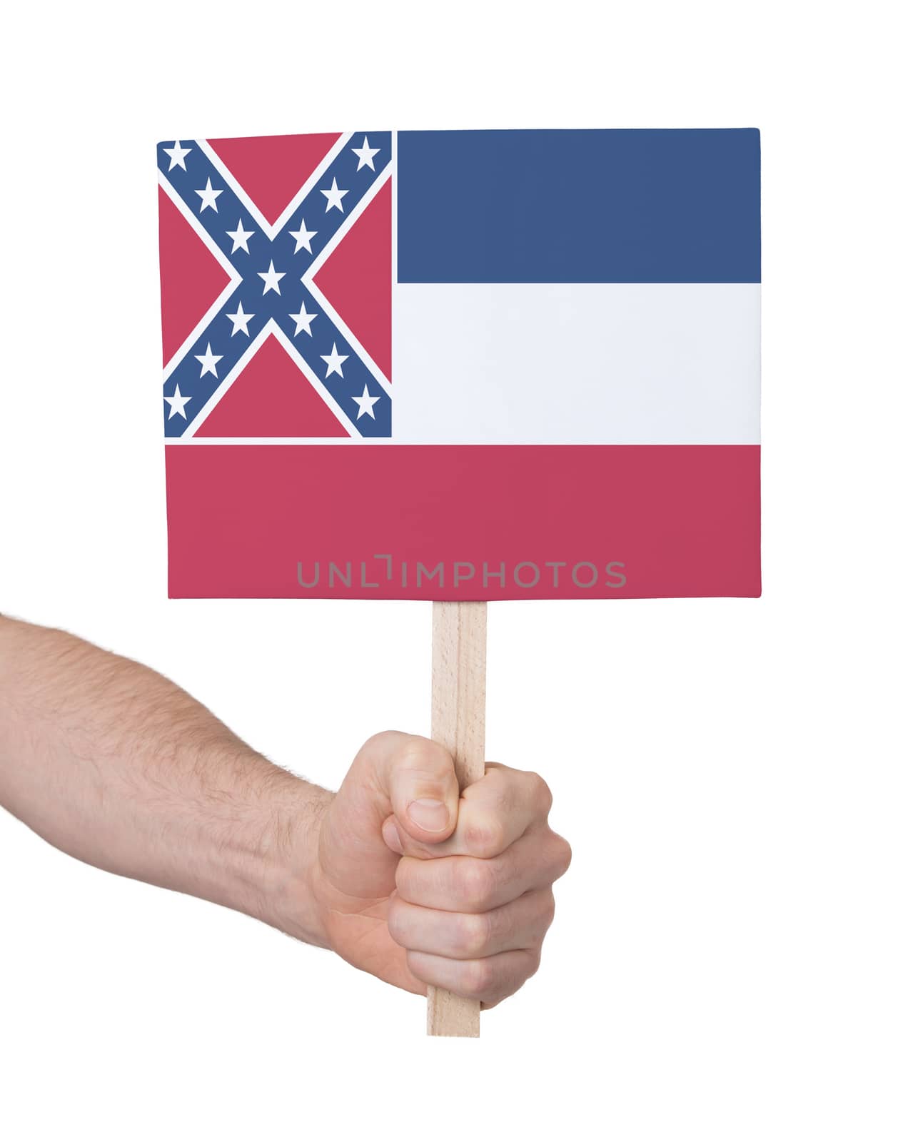 Hand holding small card, isolated on white - Flag of Mississippi