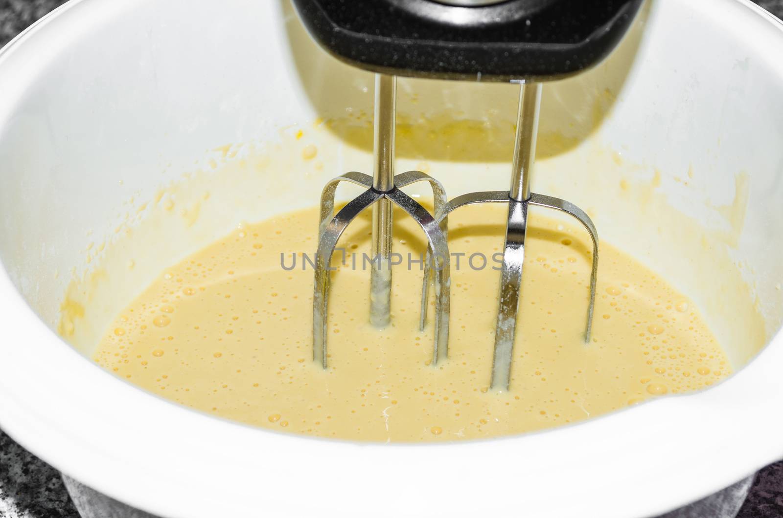 Mix flour, water, yeast salt and sugar in a bowl with mixer motor. Dough for baking a loaf of bread